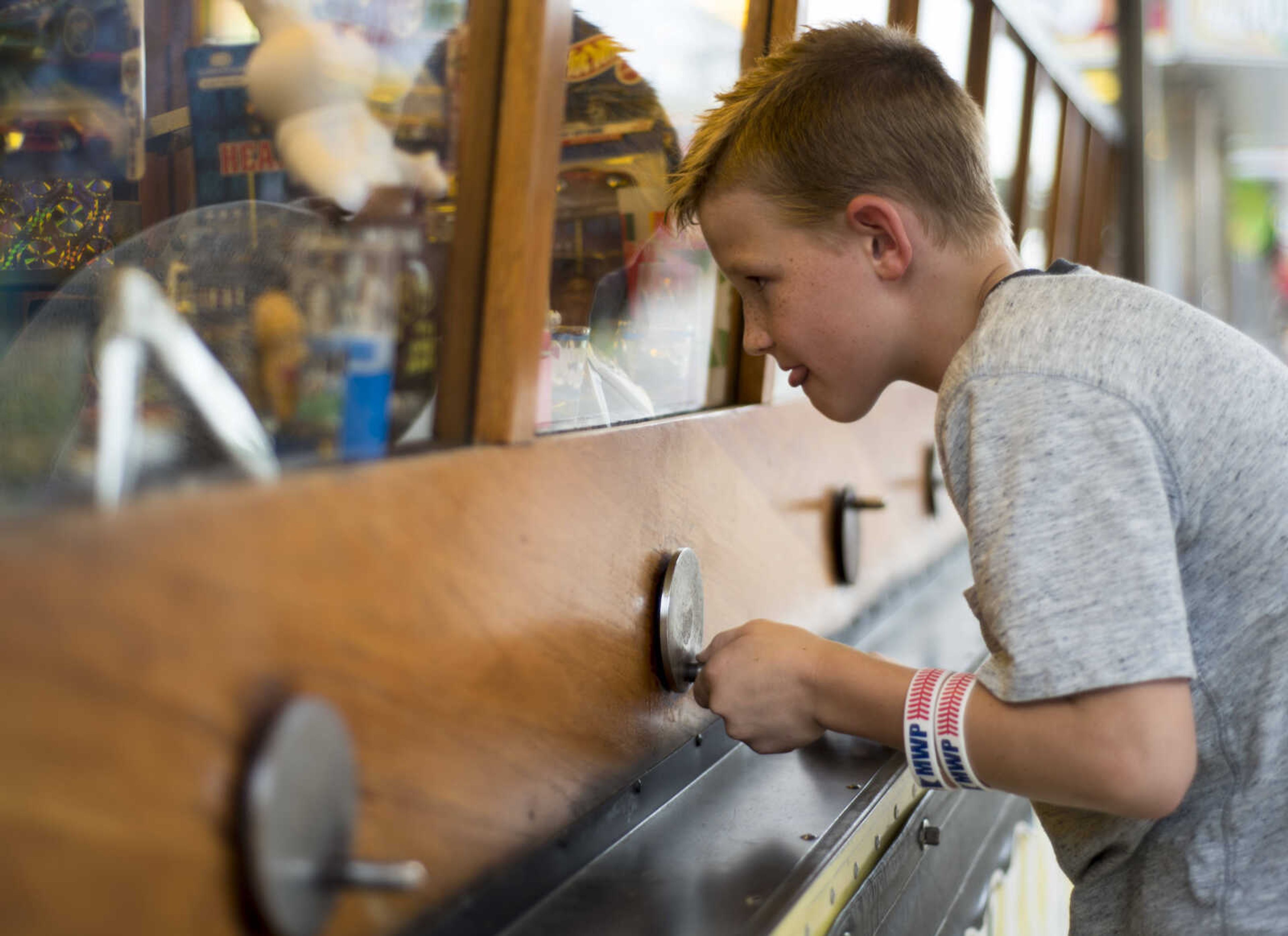 Linc Scherer, 10, plays a crane game at the SEMO District Fair on September 11, 2017, in Cape Girardeau.