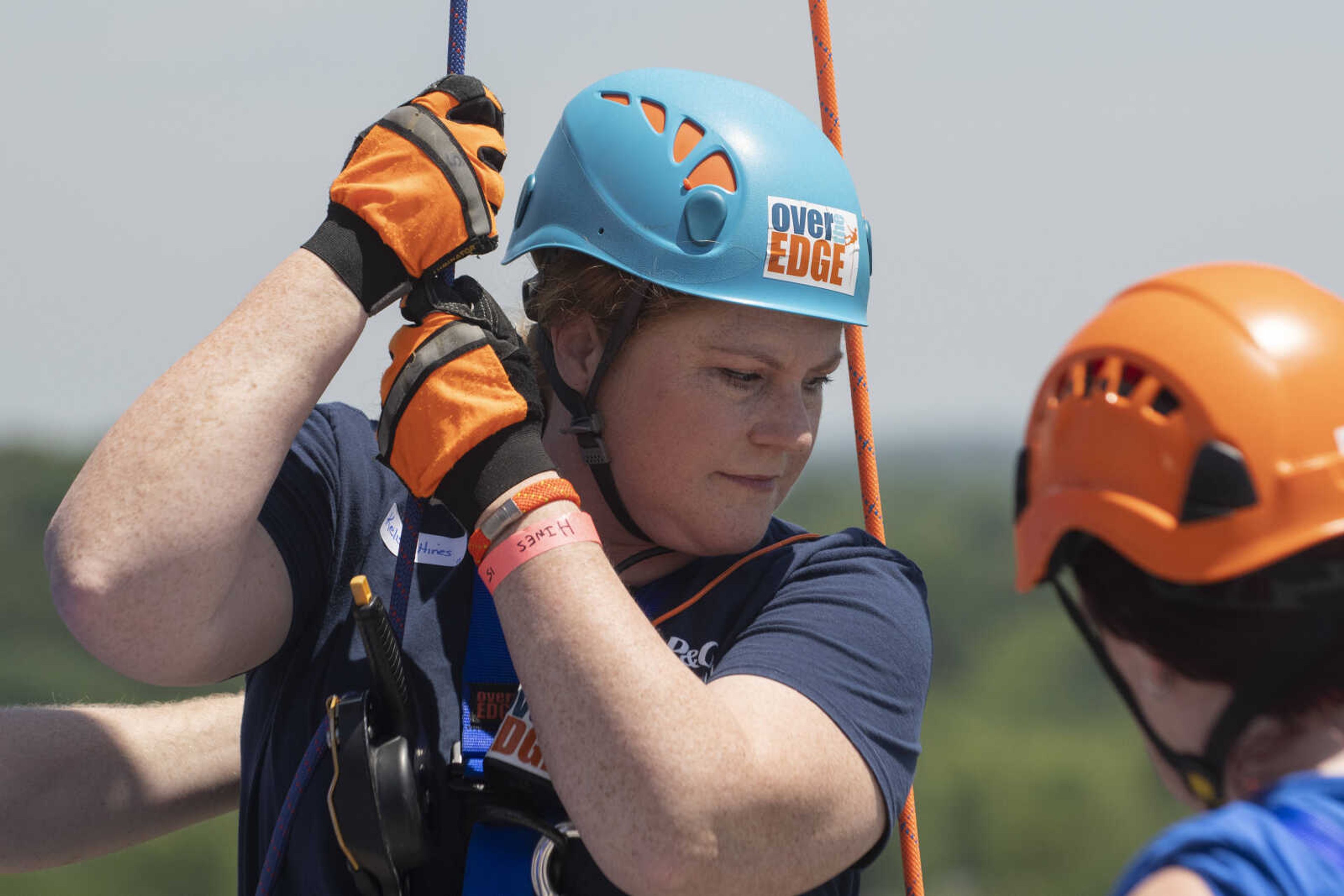 Kelison Hines of Cape Girardeau holds onto a rope shortly before rappelling down the side of Southeast Missouri State University's Towers South dormitory during the United Way of Southeast Missouri's Over the Edge fundraising event Friday, May 17, 2019, in Cape Girardeau.