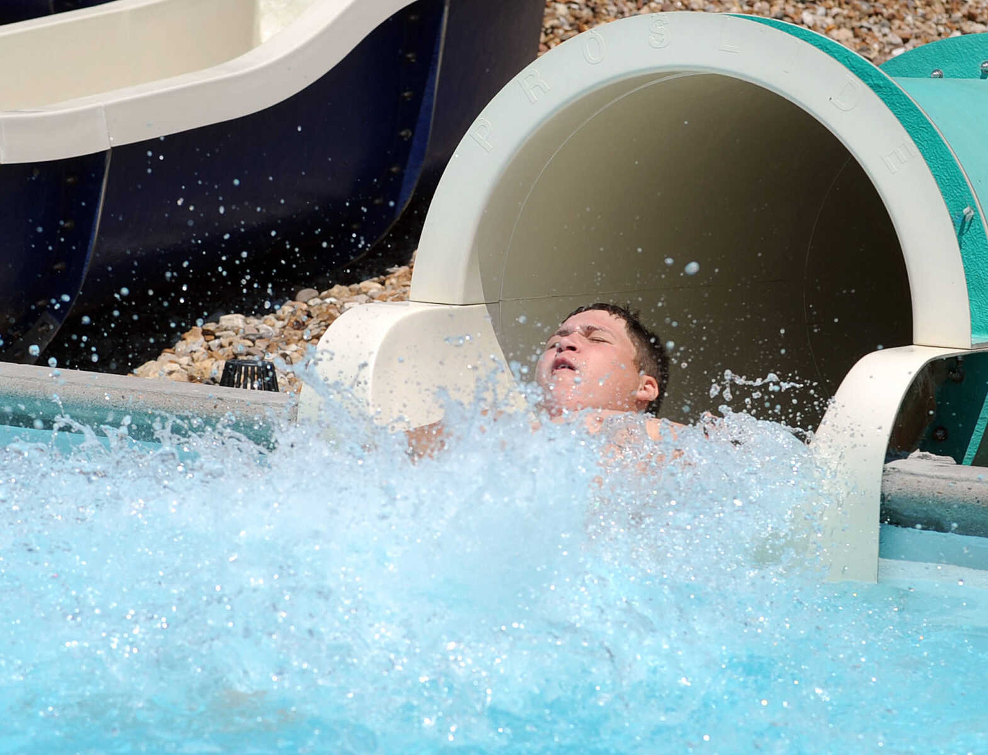 LAURA SIMON ~ lsimon@semissourian.com
Trevor James shoots out from the enclosed water slide Tuesday, May 29, 2012 at Cape Splash in Cape Girardeau.