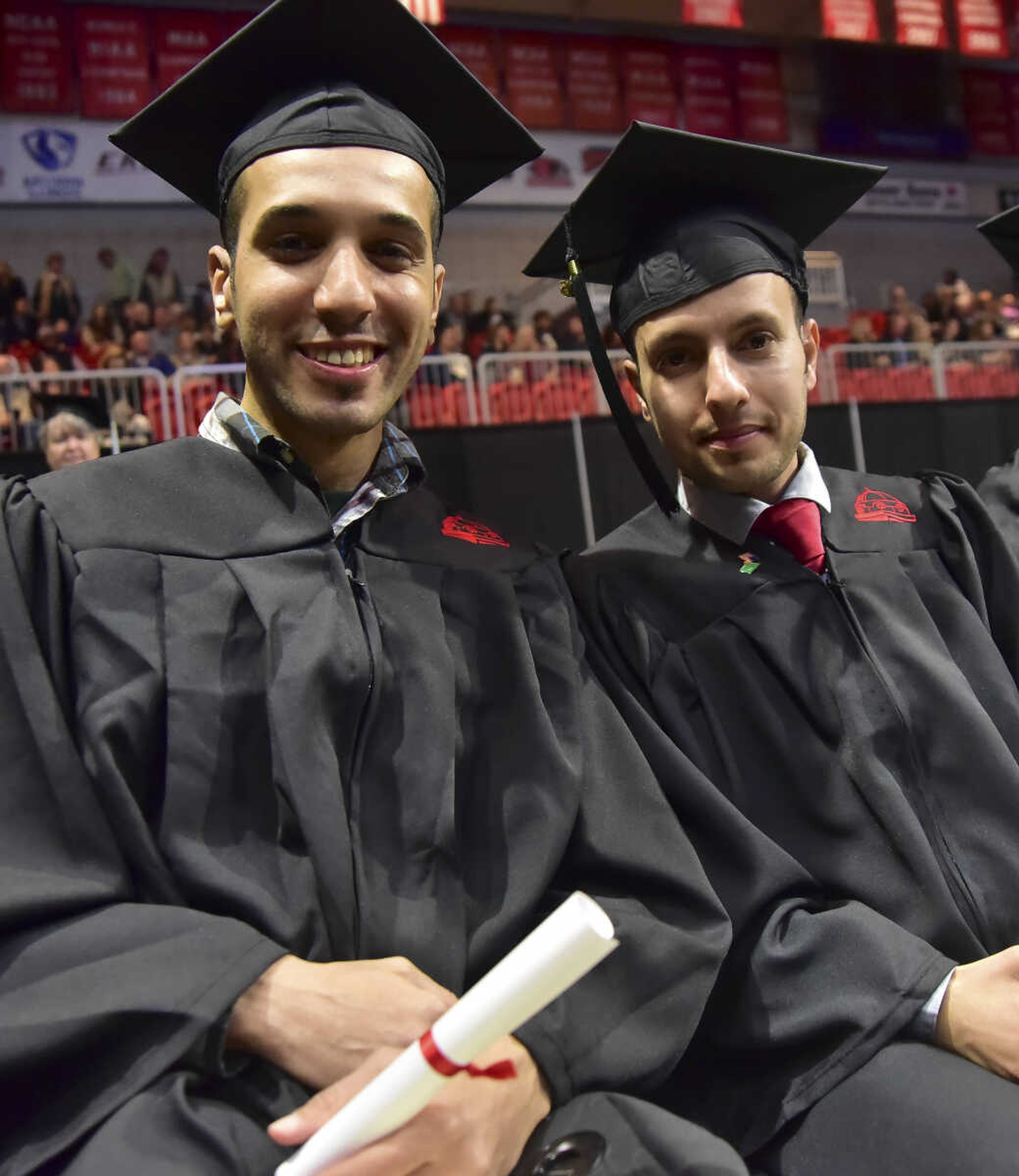 ANDREW J. WHITAKER ~ awhitaker@semissourian.com
Noor Alfaiz, left, and Ali Alzumaya, right, during Southeast Missouri State University graduation Saturday, Dec. 17, 2016 at the Show Me Center in Cape Girardeau.