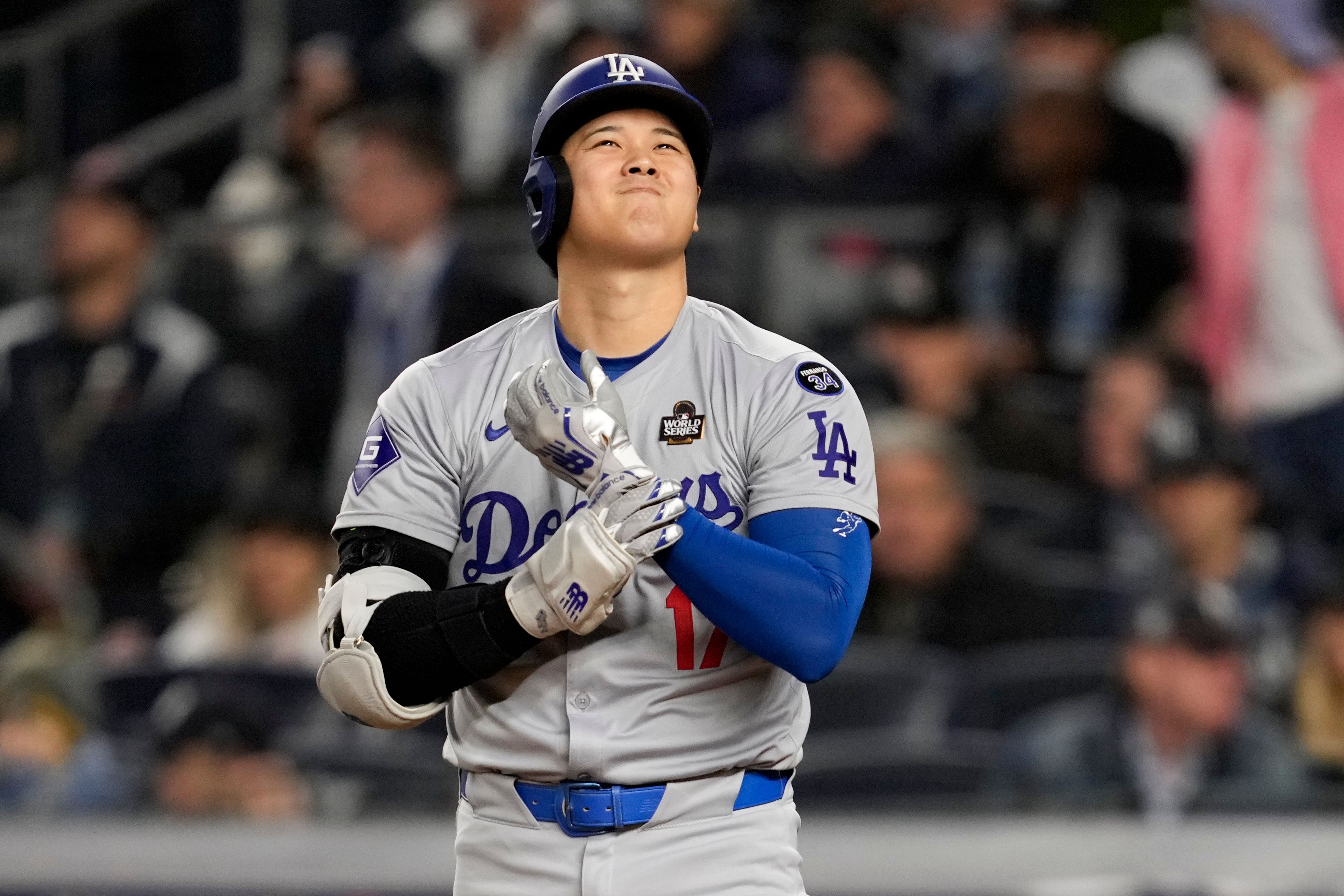 Los Angeles Dodgers' Shohei Ohtani reacts during the third inning in Game 3 of the baseball World Series against the New York Yankees, Monday, Oct. 28, 2024, in New York. (AP Photo/Ashley Landis)