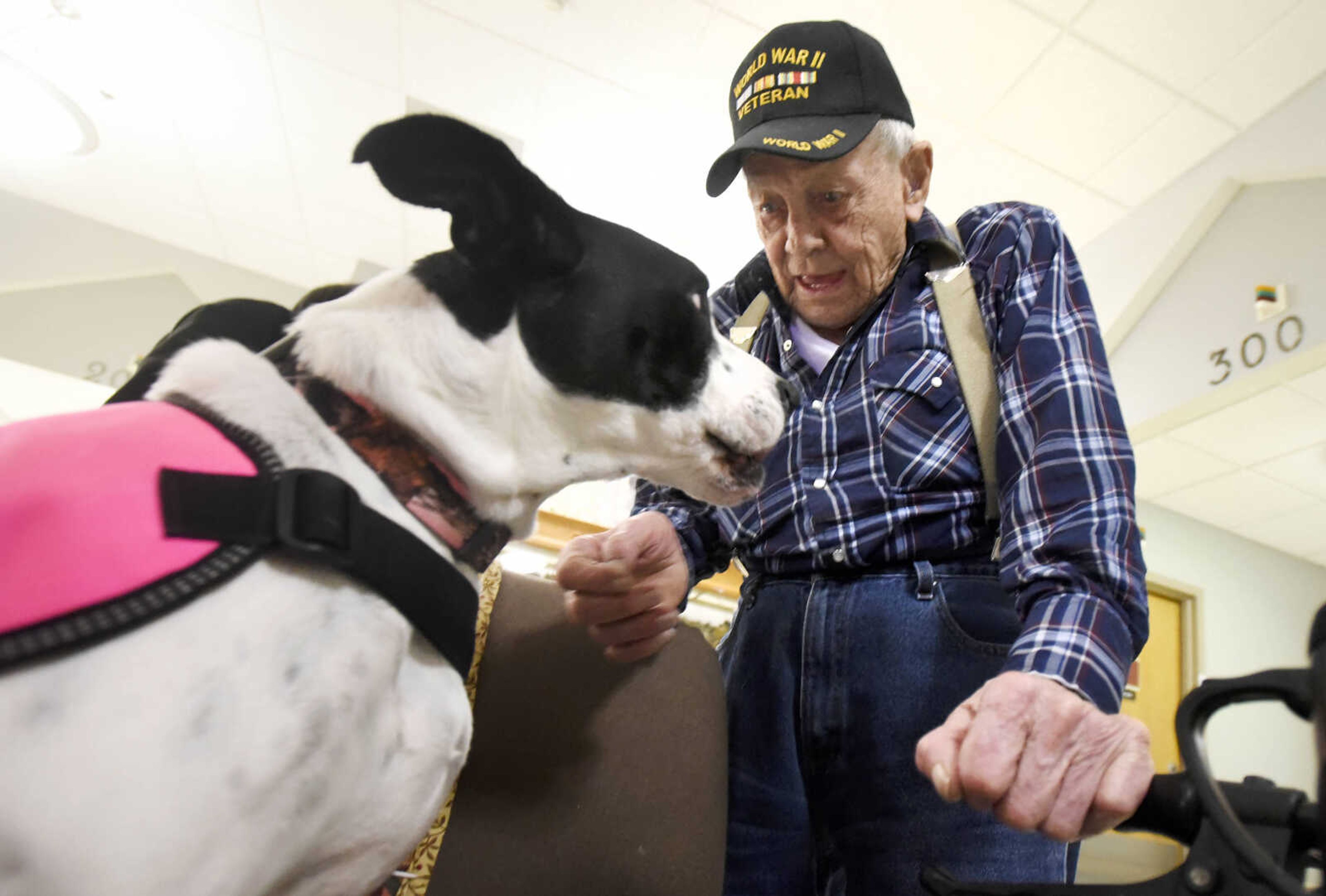 Alvin Davie visits with Lovey on Tuesday, Feb. 21, 2017, during the Pet Pals stop at the Missouri Veteran's Home in Cape Girardeau.