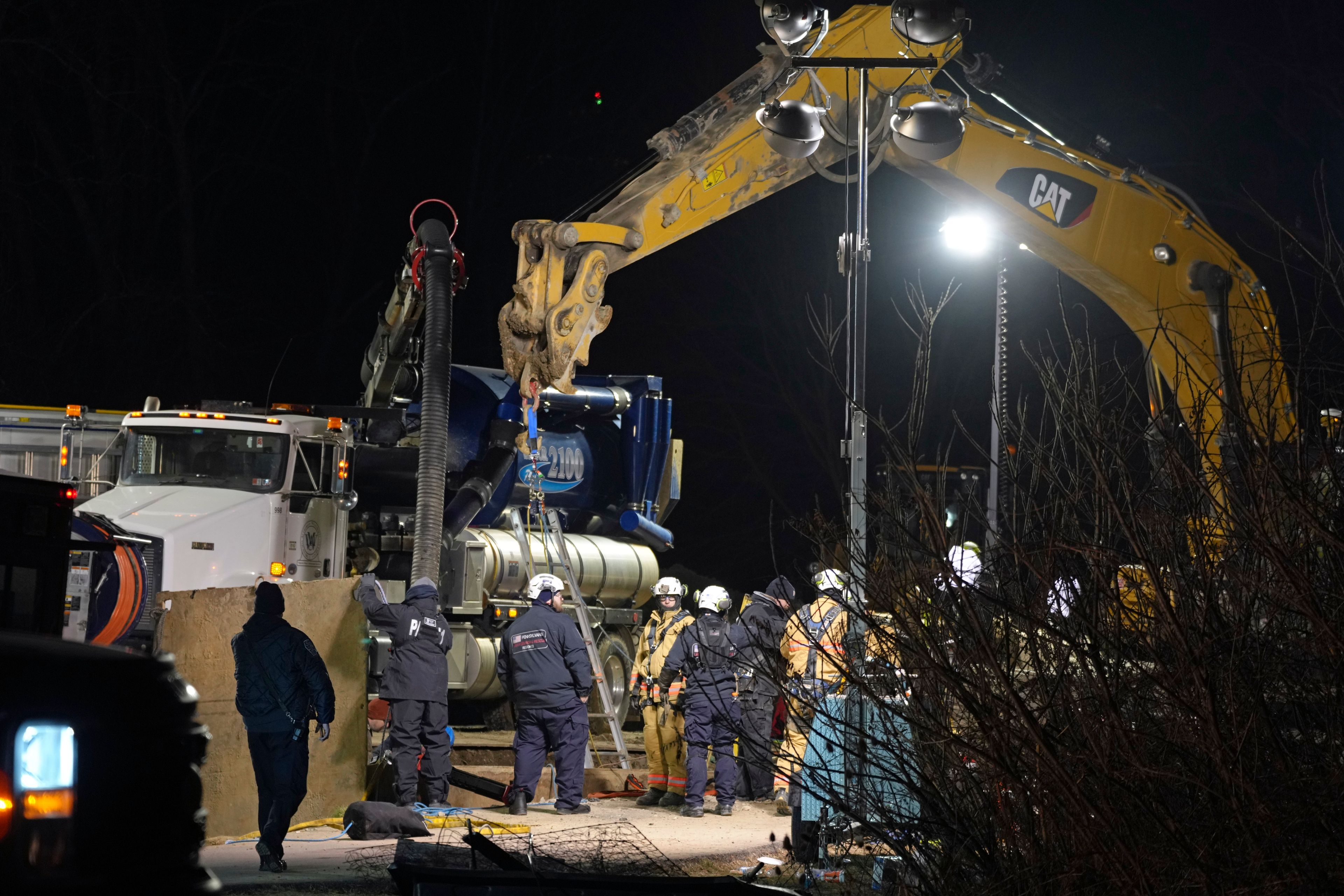 Rescuers search for woman who may have fallen into a sinkhole while looking for her lost cat