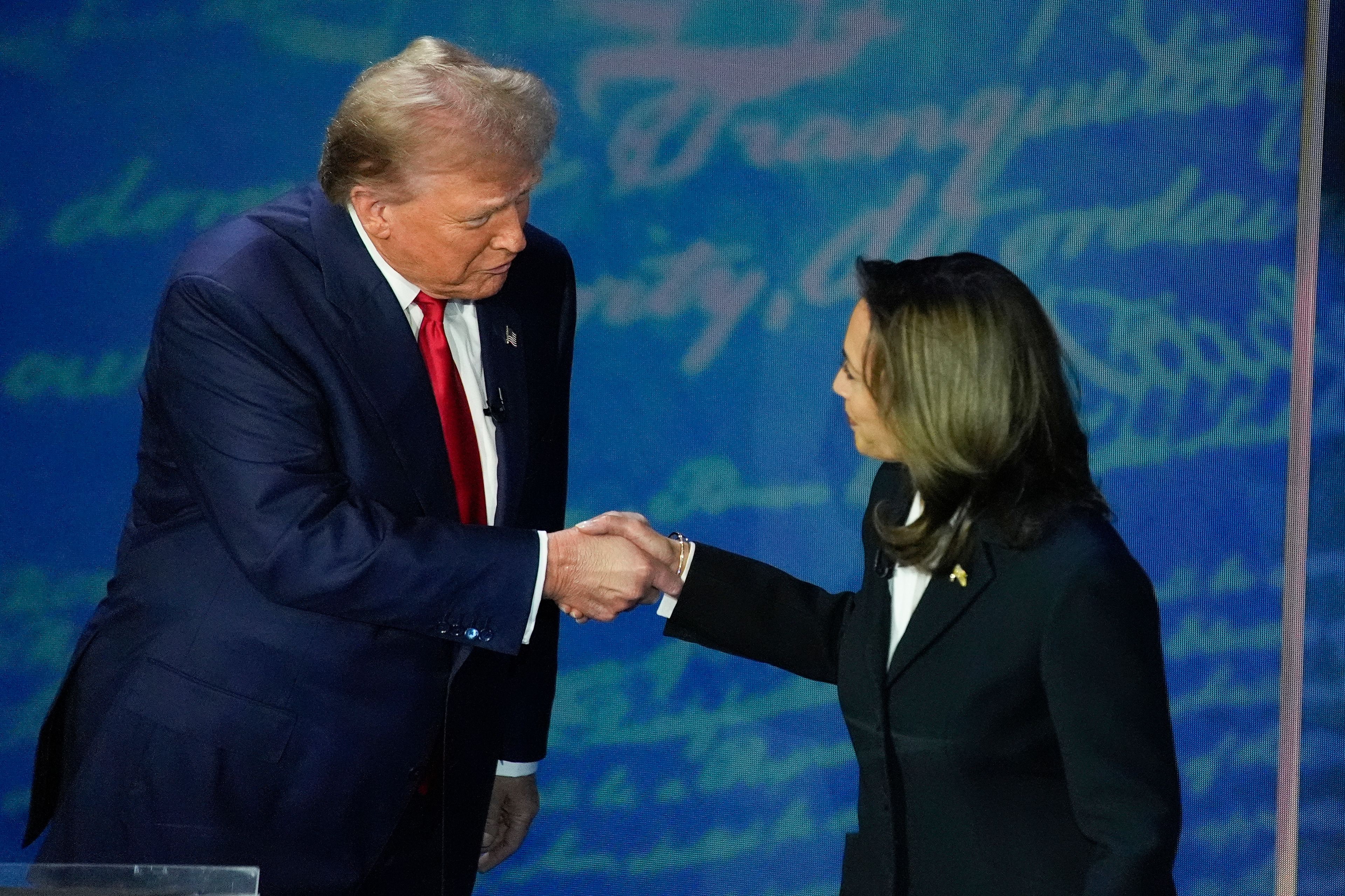 FILE - Republican presidential nominee former President Donald Trump and Democratic presidential nominee Vice President Kamala Harris shake hands before the start of an ABC News presidential debate at the National Constitution Center, Sept. 10, 2024, in Philadelphia. (AP Photo/Alex Brandon, file)