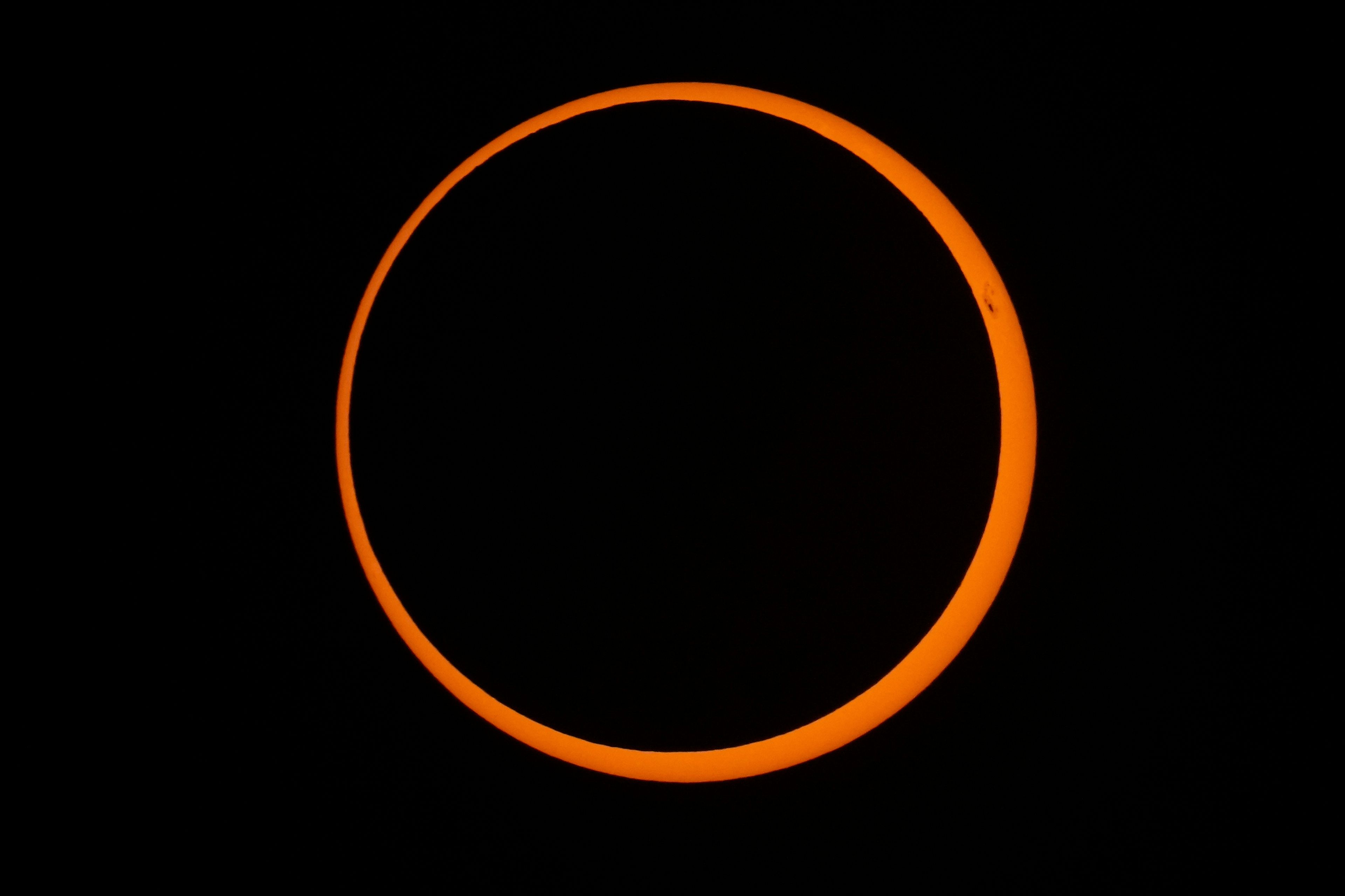 The moon moves across the sun during an annular solar eclipse in Tahai, Rapa Nui, or Easter Island, Chile, Wednesday, Oct. 2, 2024. (AP Photo/Esteban Felix)