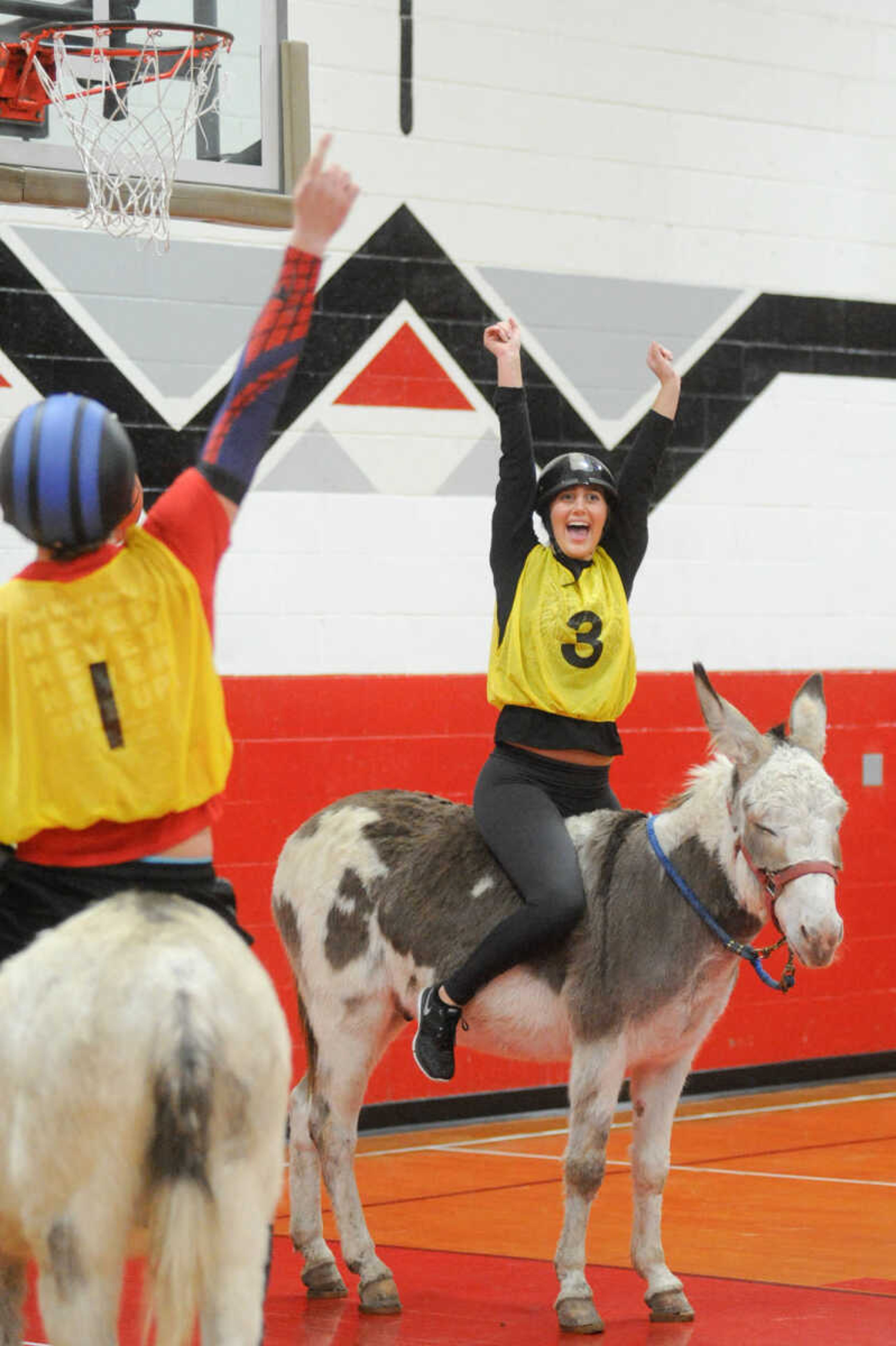 GLENN LANDBERG ~ glandberg@semissourian.com

Jackson High School senior Lindsey Breer celebrates after scoring in the first quarter during the Project Graduation Donkey Basketball Game Saturday, Dec. 5, 2015 in Jackson.