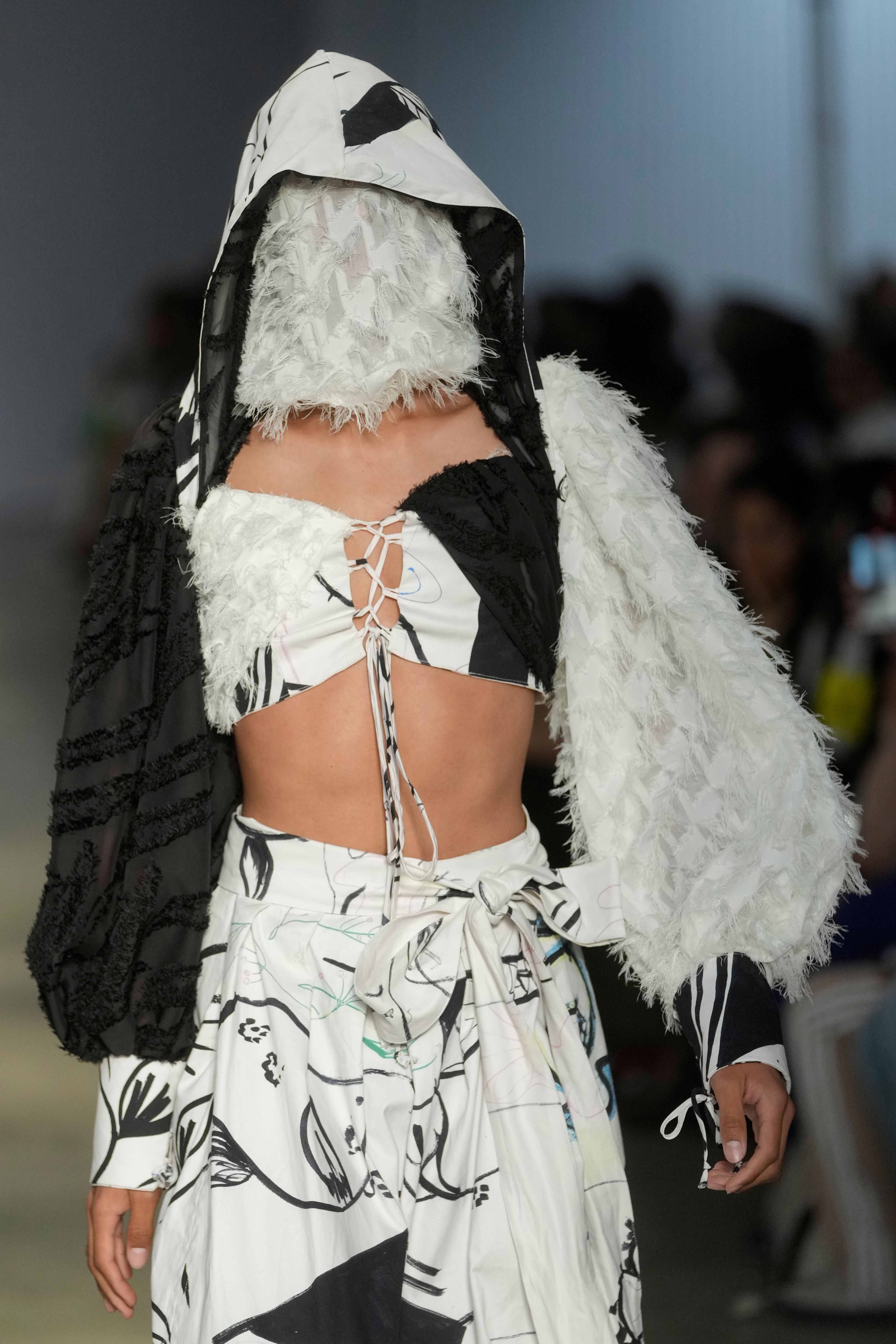 A model wears a creation from the Cria Costura collection during Sao Paulo Fashion Week in Sao Paulo, Thursday, Oct. 17, 2024. (AP Photo/Andre Penner)