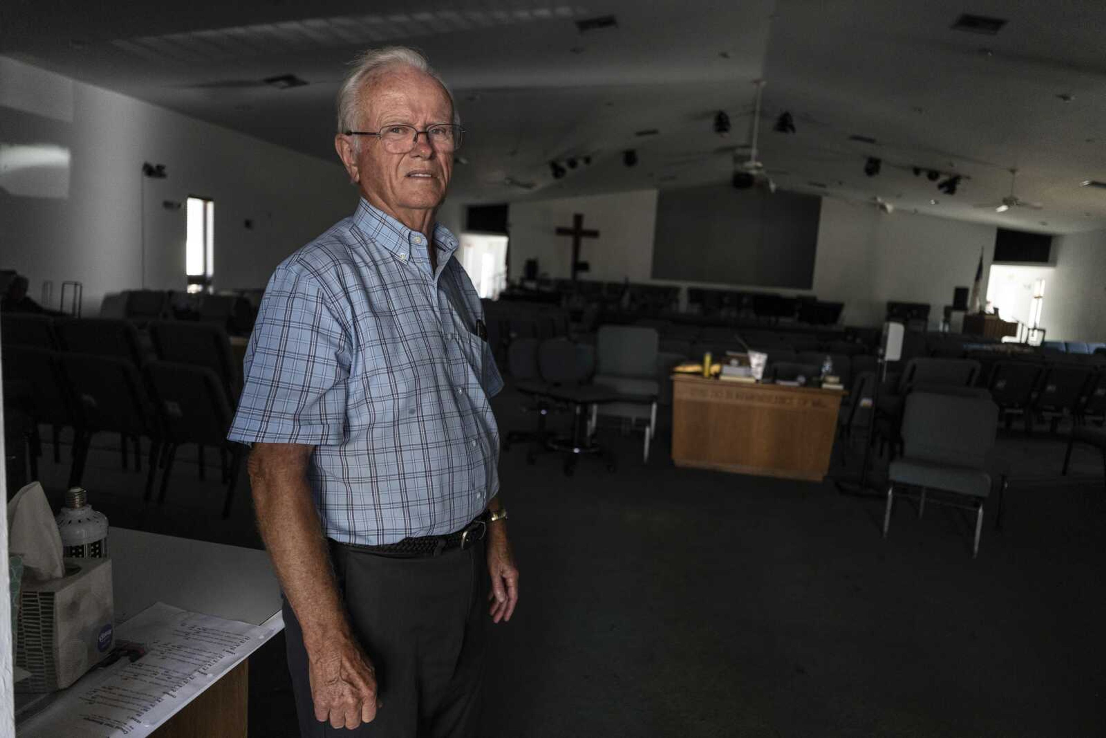 The Rev. Robert Kasten, pastor at Southwest Baptist Church in Fort Myers, Florida, stands in the sanctuary Sunday, where parishioners took refuge as Hurricane Ian swept through Southwest Florida.