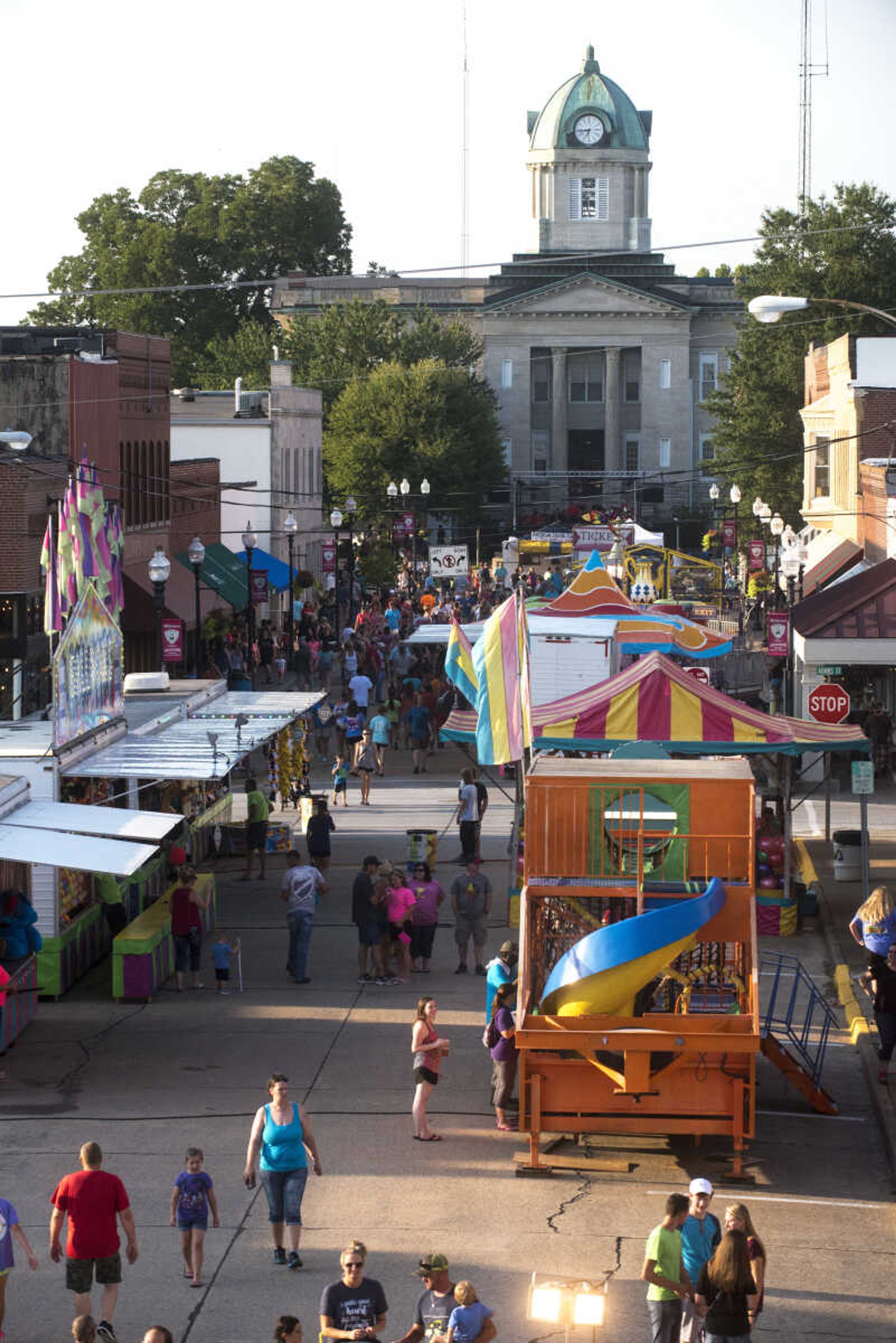 People roam around at the Jackson Homecomers Tuesday, July 25, 2017 in Uptown Jackson.