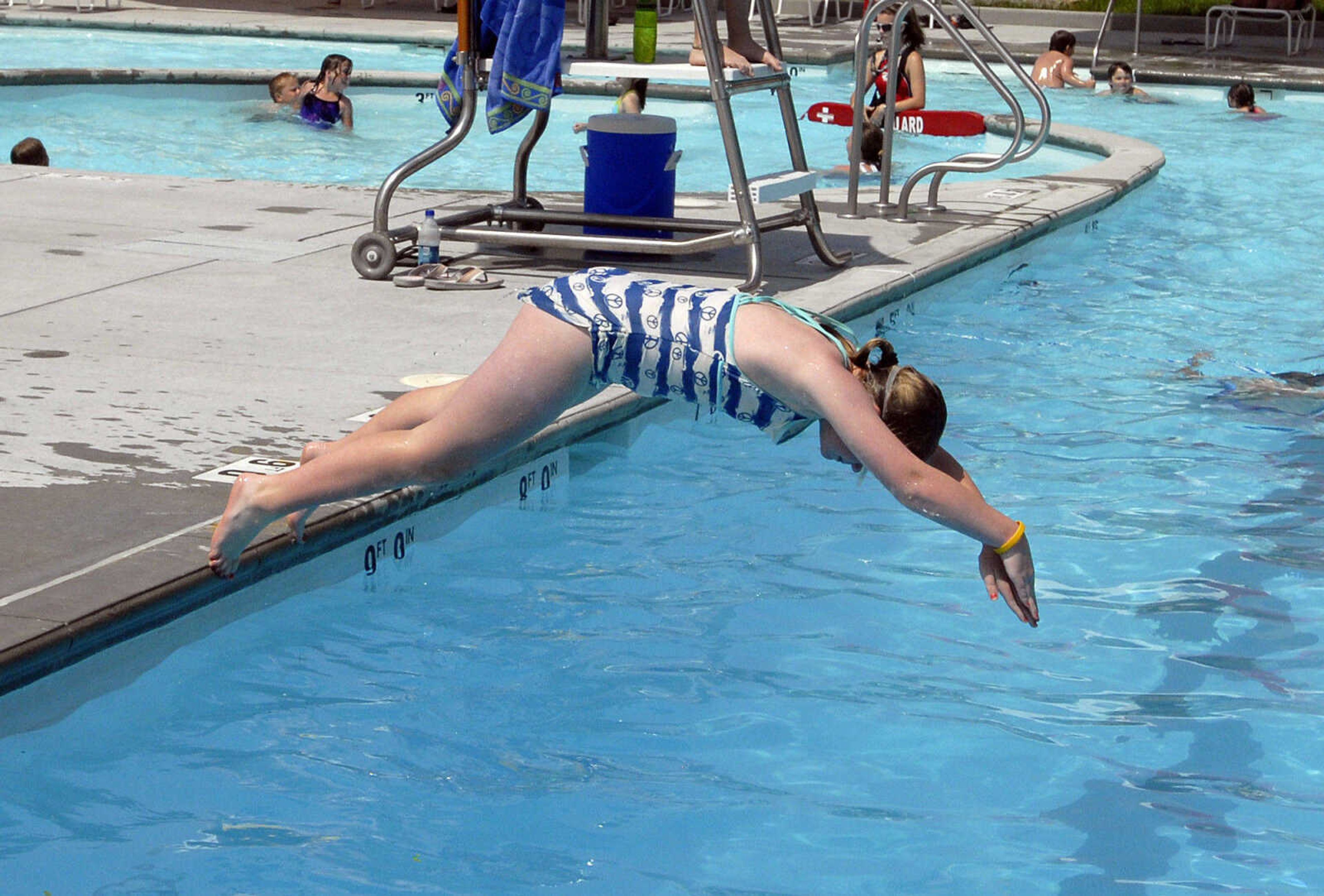 LAURA SIMON~lsimon@semissourian.com
Zoie Roth dives into the leisure pool Saturday, May 28, 2011 during opening day of Cape Splash Family Aquatic Center in Cape Girardeau.