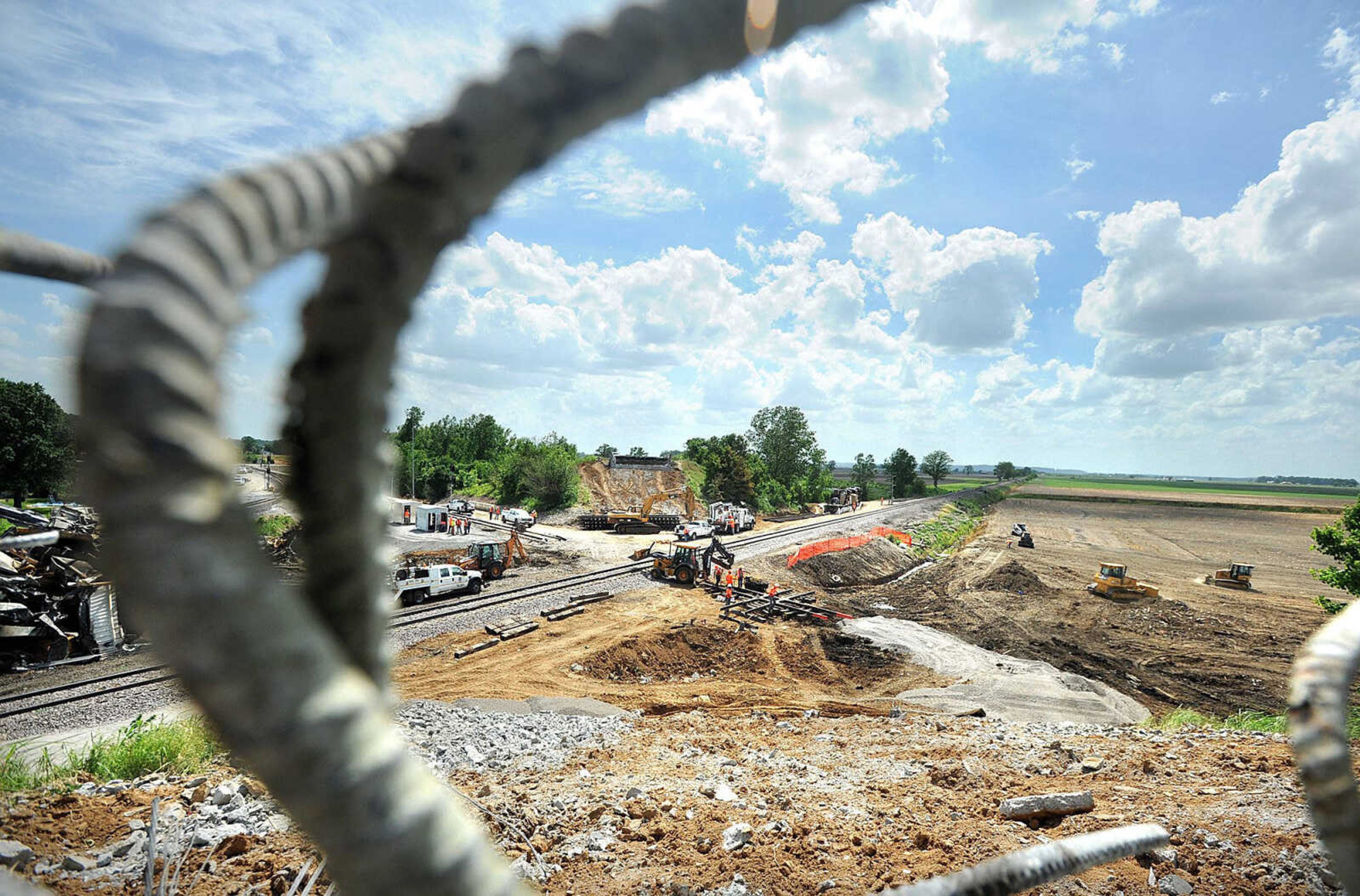 Rebar sticks out of where the Route M overpass once stood Wednesday in Rockview, Mo. Crews are cleaning up the area where two trains collided Saturday, causing the Route M overpass to collapse. (Laura Simon)