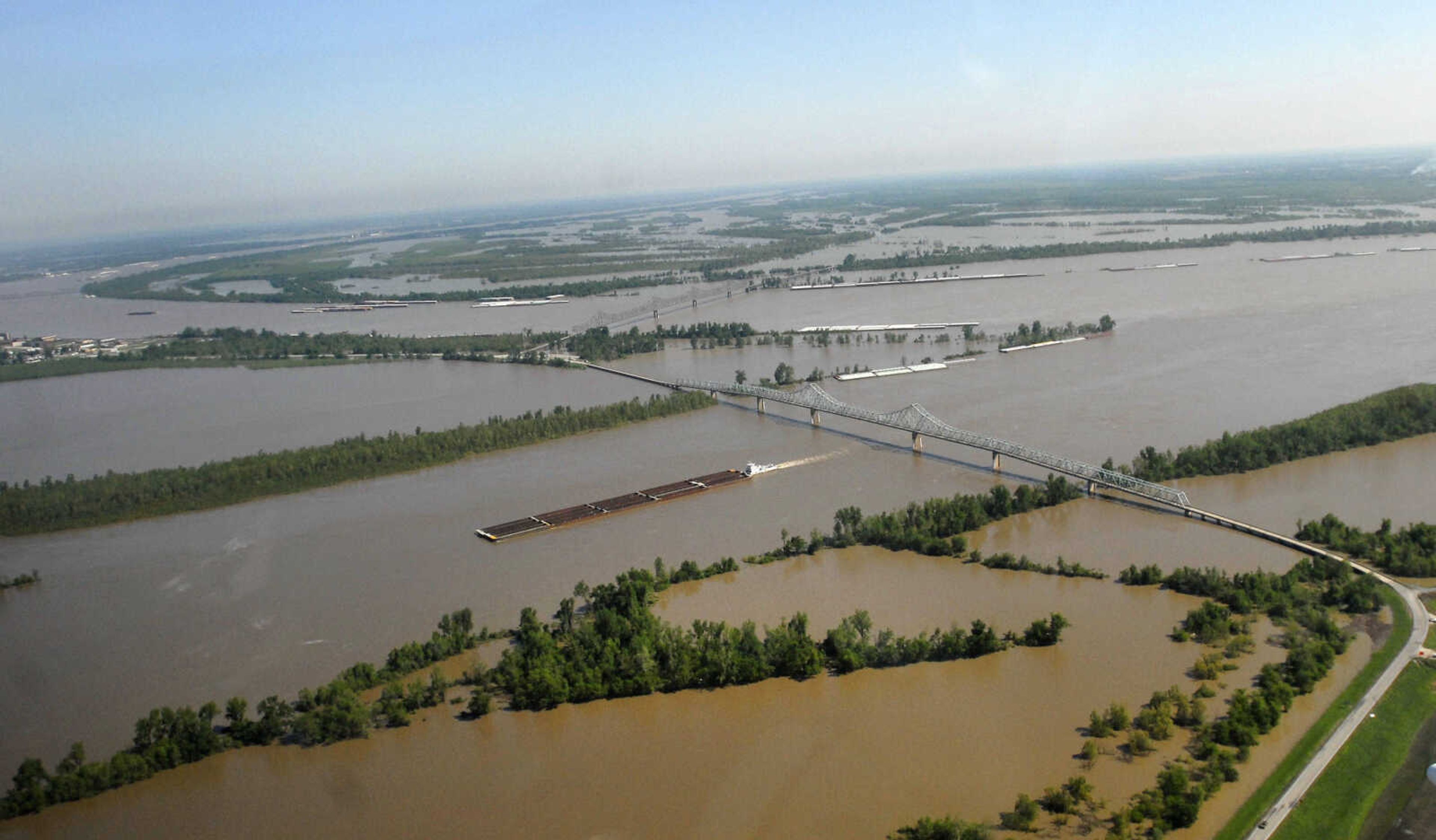 KRISTIN EBERTS ~ keberts@semissourian.com

A barge passes under the US-60/62 bridge at Cairo, Ill., on Thursday, April 28, 2011. In the background, barges head up the Ohio River.