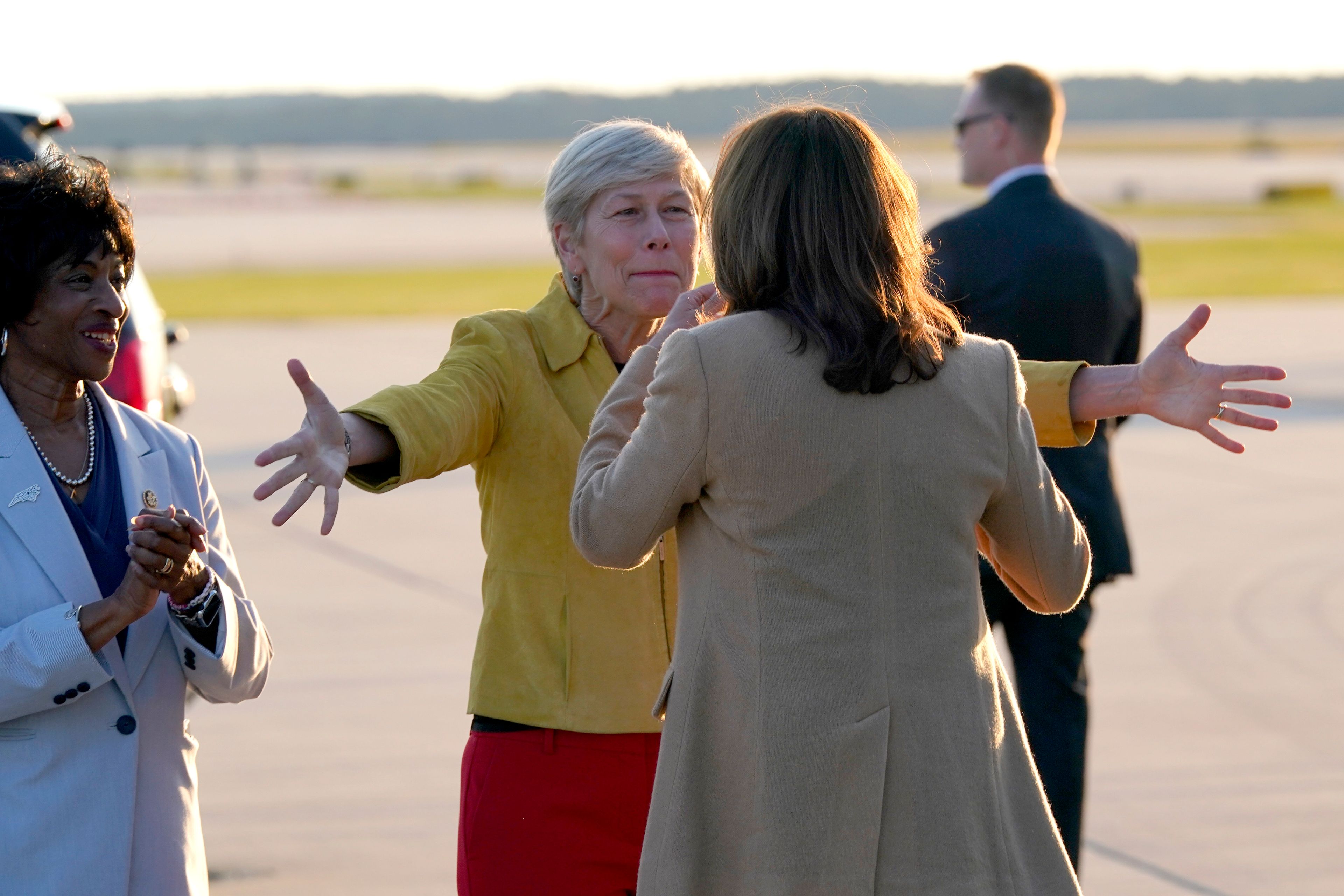 Rep. Valerie Foushee, D-N.C, from left, and Rep. Deborah Ross, D-N.C., greet Democratic presidential nominee Vice President Kamala Harris as she arrives at Raleigh-Durham International Airport in Morrisville, N.C., Saturday, Oct. 12, 2024. (AP Photo/Steve Helber)