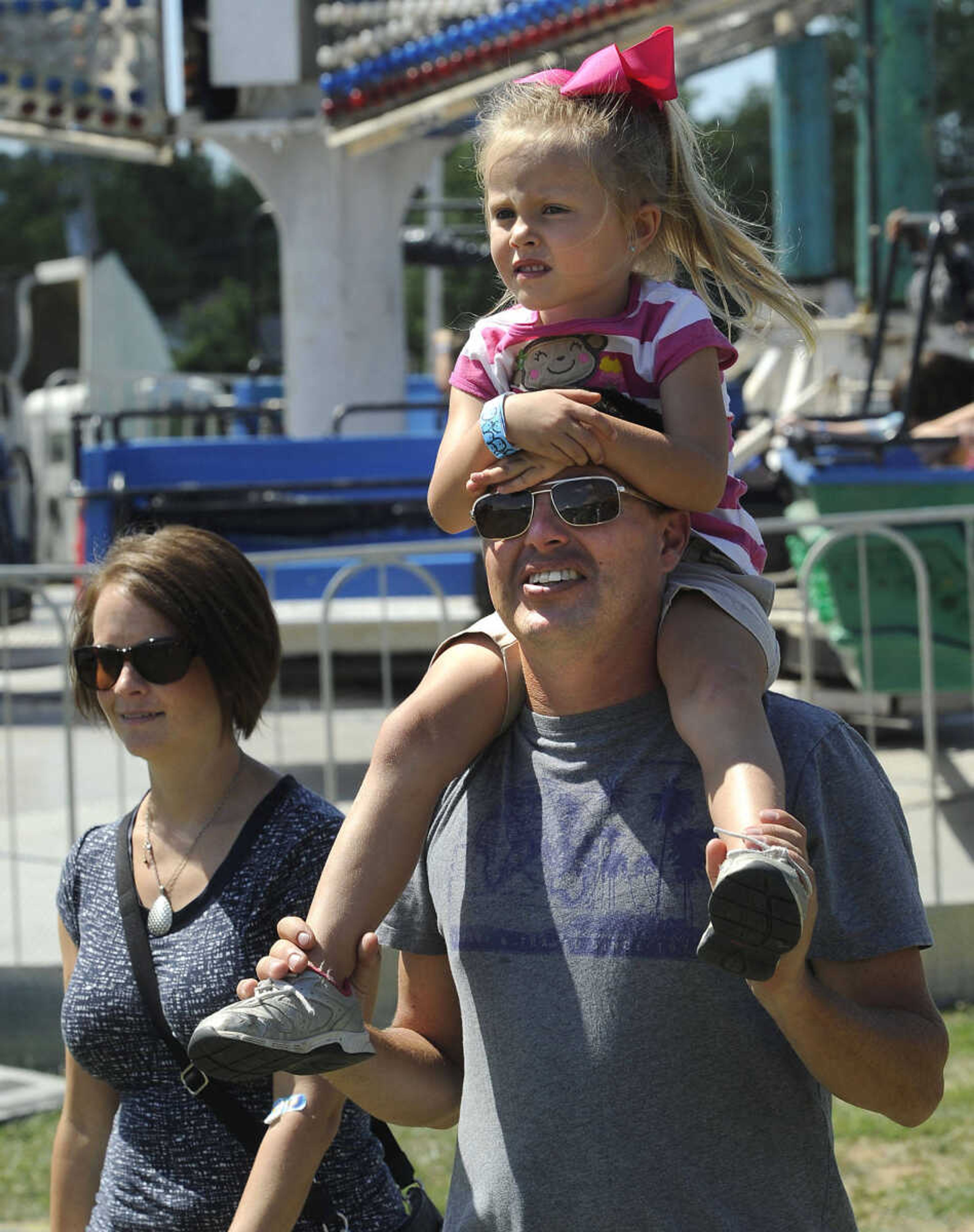 FRED LYNCH ~ flynch@semissourian.com
Brynnan Grimes enjoys a free ride at the carnival with her parents, Mark and Misty Grimes of Cape Girardeau, Sunday, Sept. 7, 2014 at the SEMO District Fair.