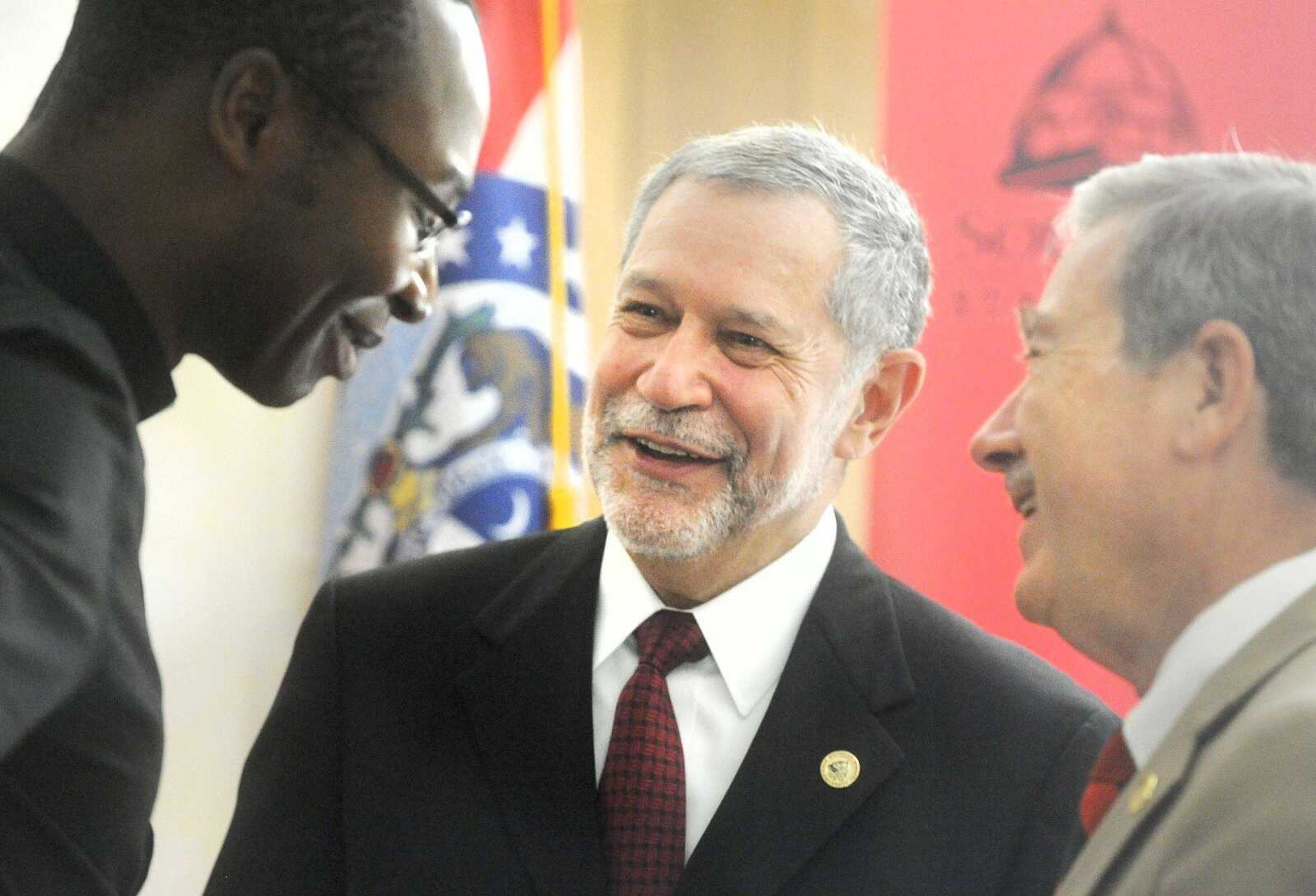 Southeast Missouri State University's new president, Carlos Vargas-Aburto, center, speaks with Father Patrick Nwokoye, left, and Thomas M. Meyer, on Aug. 24  at the Grauel Building on the university's campus.