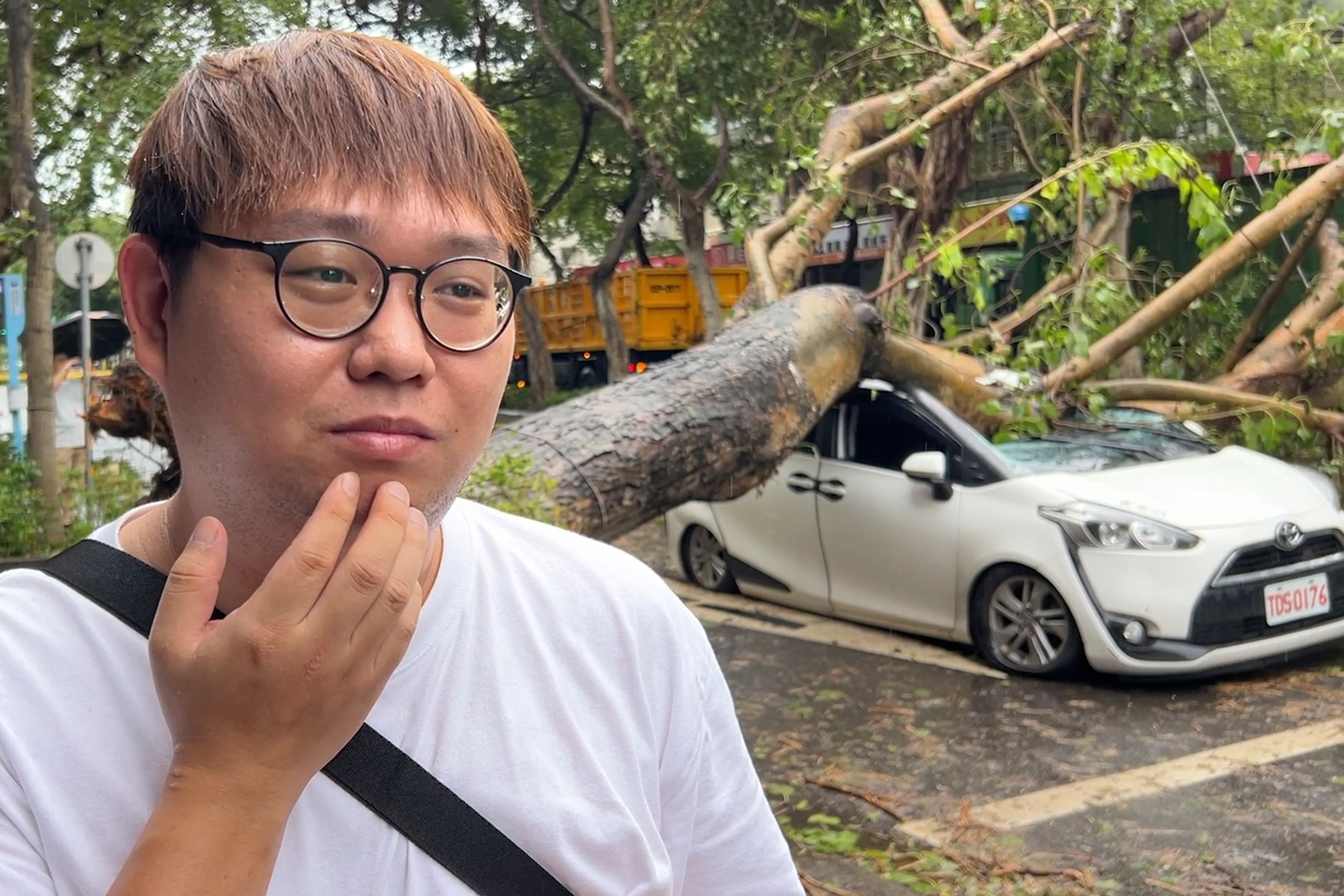 Song Zi-jie, 28 years old ride-hailing service driver, talks about his experience a day after a tree collapsed on his car while he was inside as Typhoon Kong-rey sweeps through Taipei, Taiwan on Friday, Nov. 1, 2024. (AP Photo/Johnson Lai)