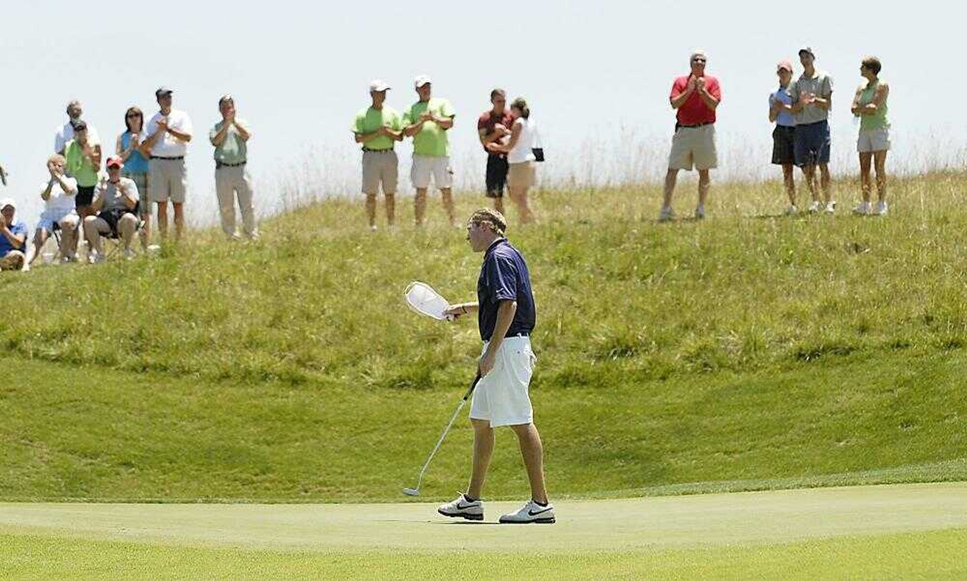 Ty Spinella acknowledged the crowd after putting out on the 18th hole to win the AJGA Dalhousie Junior Championship on Thursday. (Kit Doyle)