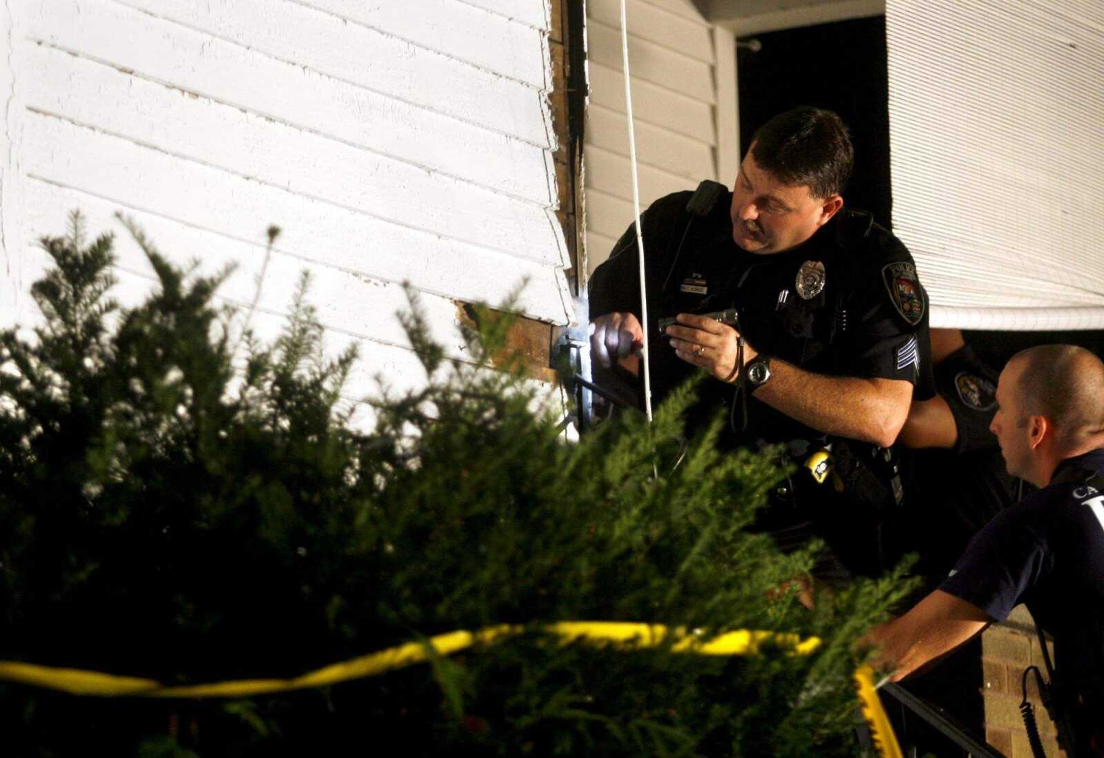 ELIZABETH DODD ~ edodd@semissourian.com
Sgt. Rick Schmidt pointed out a bullet hole in a home on Hanover St. after a shooting Wednesday night where three people were wounded.