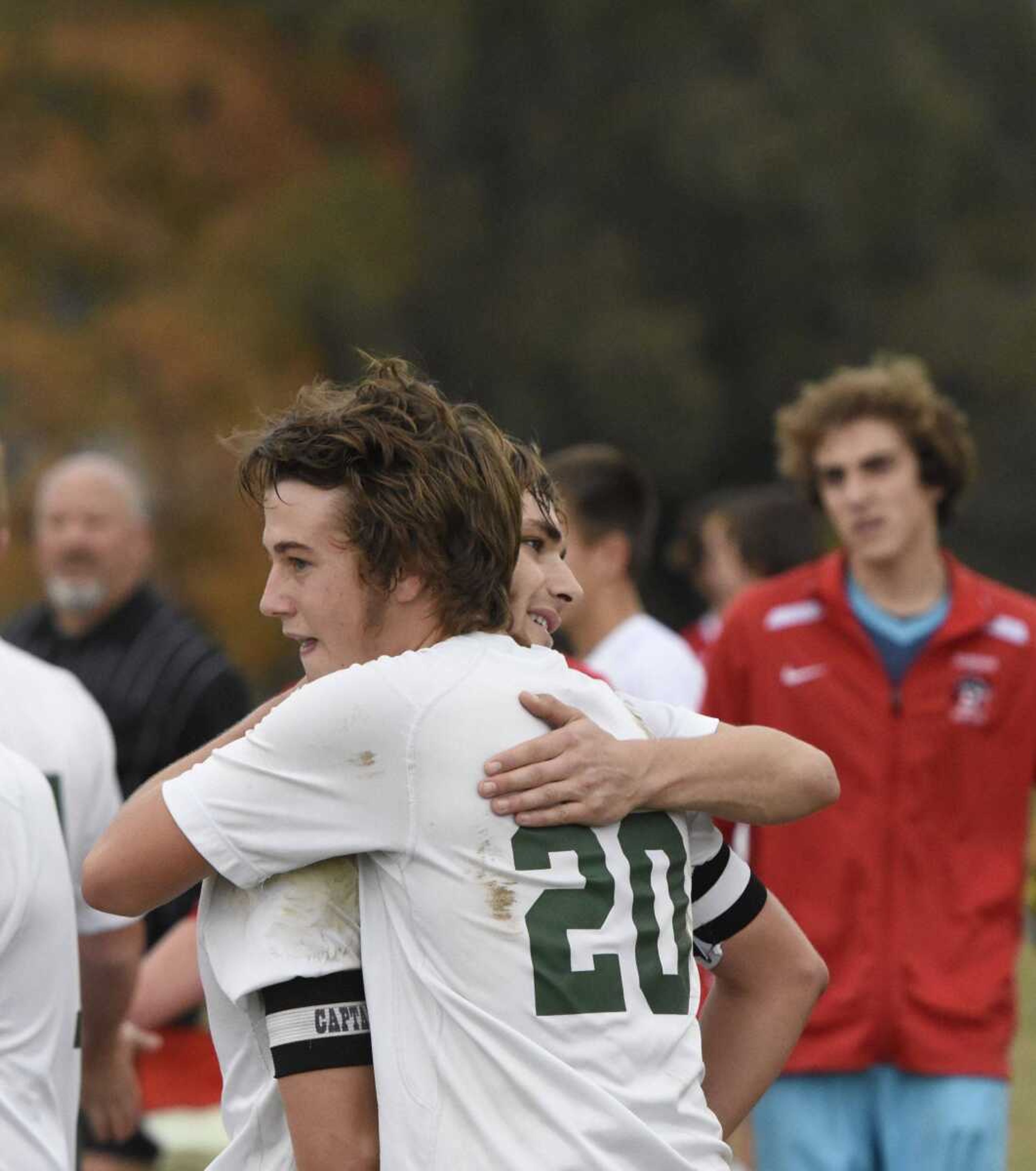 Perryville's Eann Bergman (20) hugs teammate Kyle Wood after winning a Class 2 quarterfinal over Bishop DuBourg Saturday in Perryville.