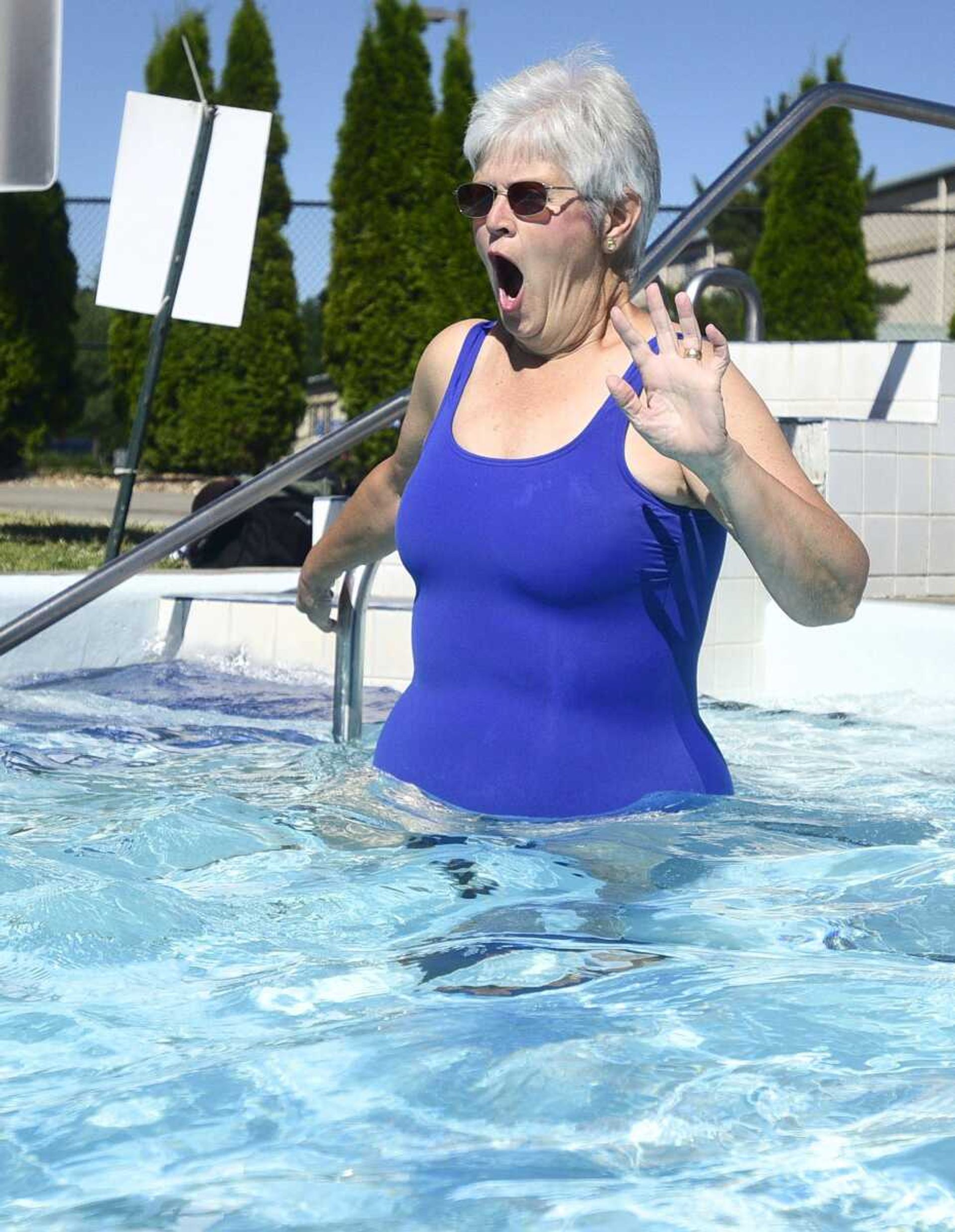 Daphne Fiehler reacts to the cold water as she enters the lazy river on Monday, June 19, at Cape Splash.