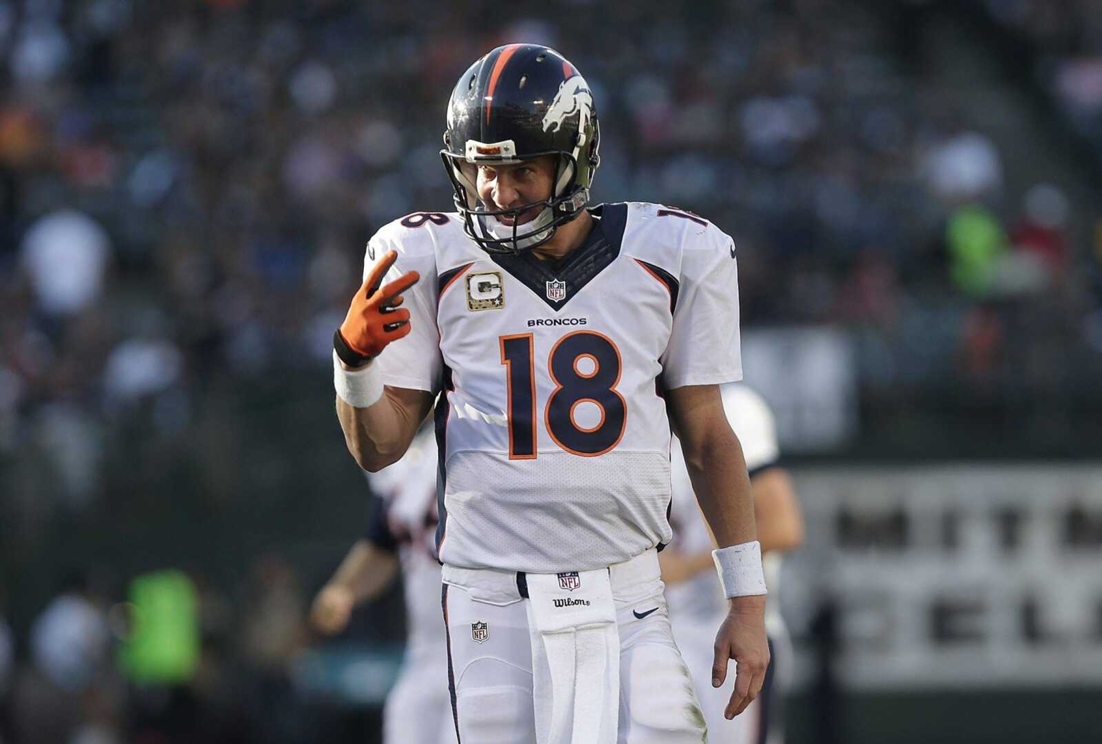 Broncos quarterback Peyton Manning reacts after throwing a 15-yard touchdown pass to wide receiver Emmanuel Sanders during the third quarter of last week's game against the Raiders in Oakland, California. (Marcio Jose Sanchez ~ Associated Press)