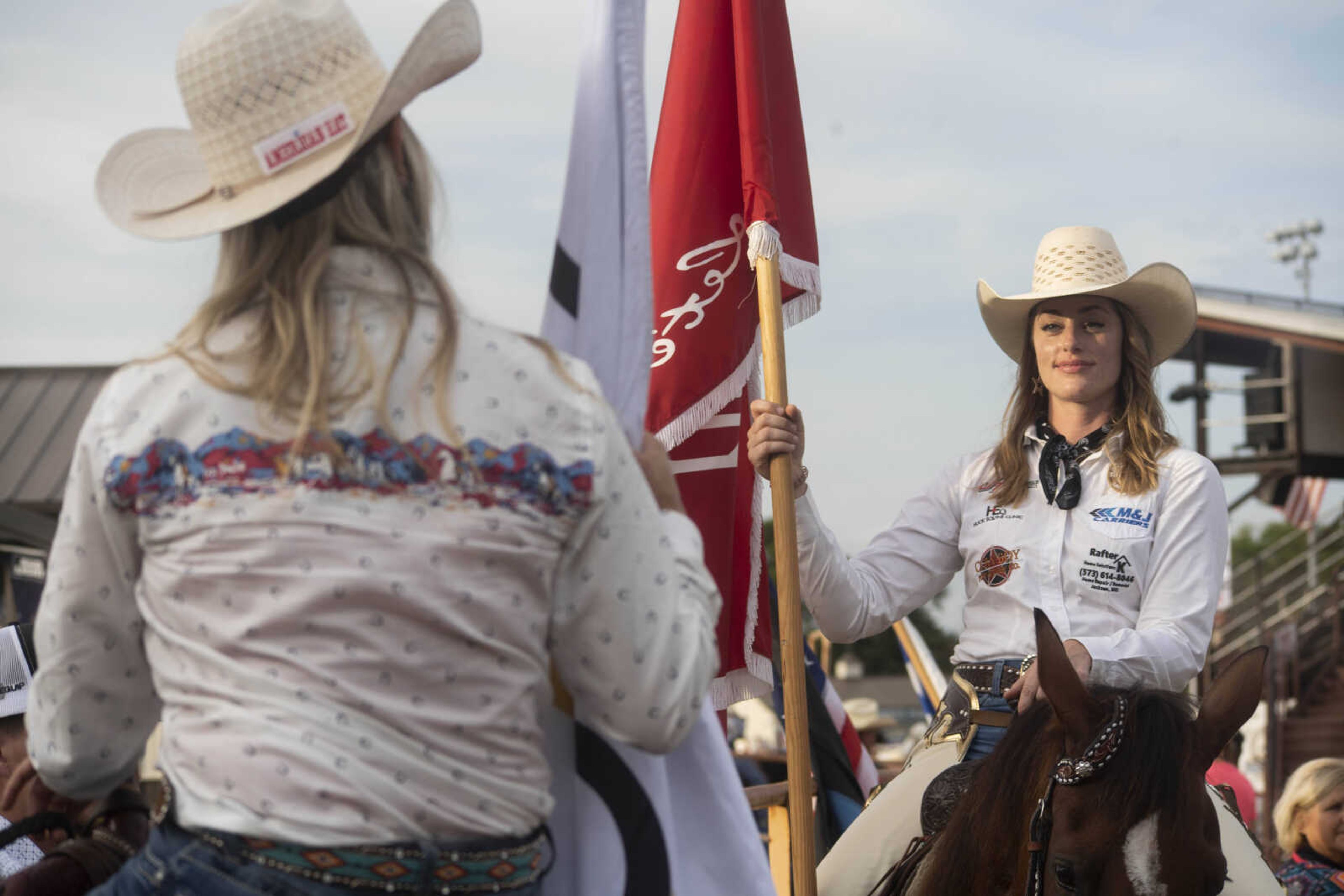 Performers talk behind the arena before the third night of the Sikeston Jaycee Bootheel Rodeo Friday, Aug. 13, 2021,&nbsp;&nbsp;in Sikeston, Missouri.