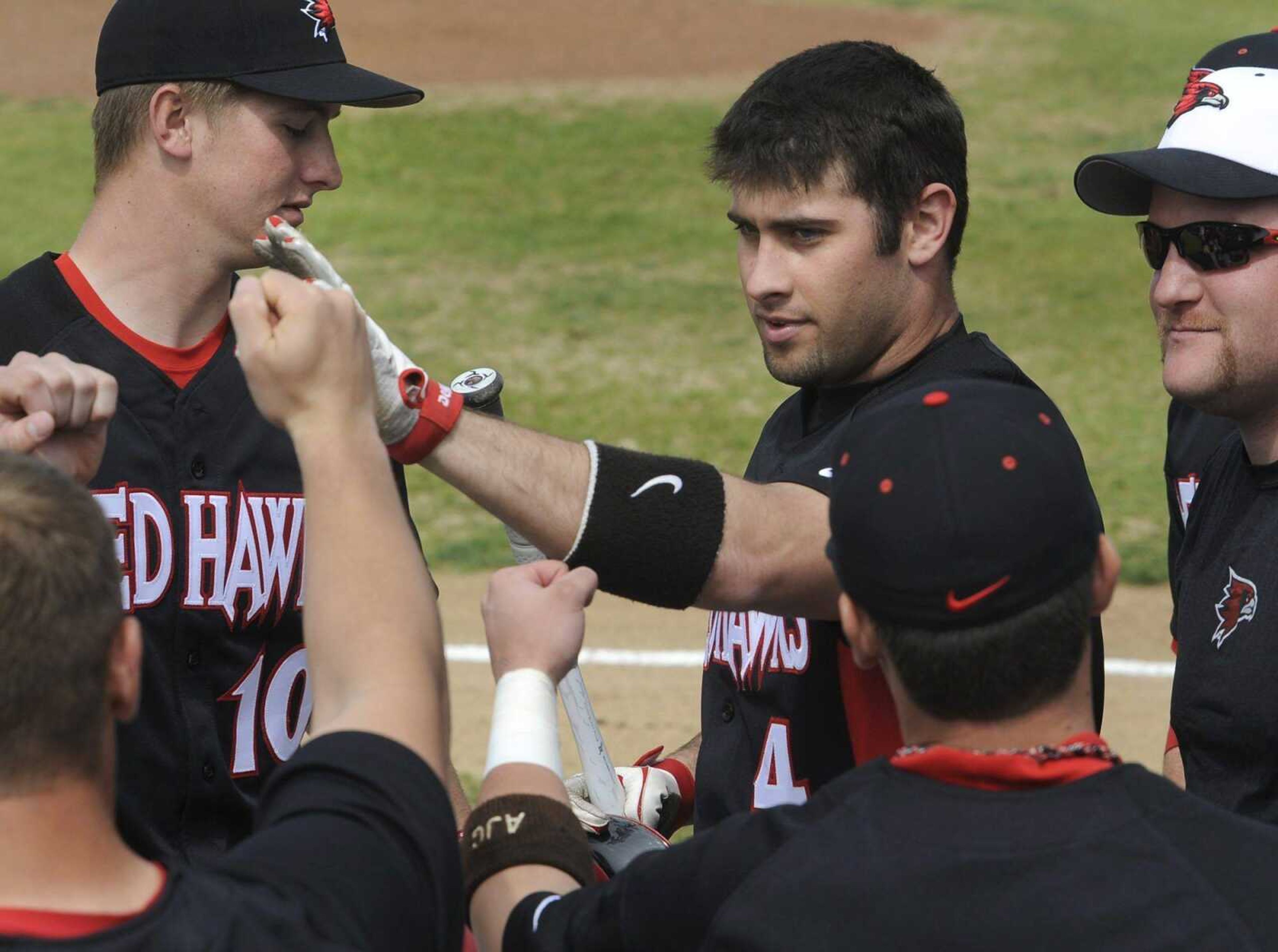 Southeast Missouri State's Kenton Parmley is congratulated by teammates after hitting a home run against Wright State during the second inning Saturday at Capaha Field.