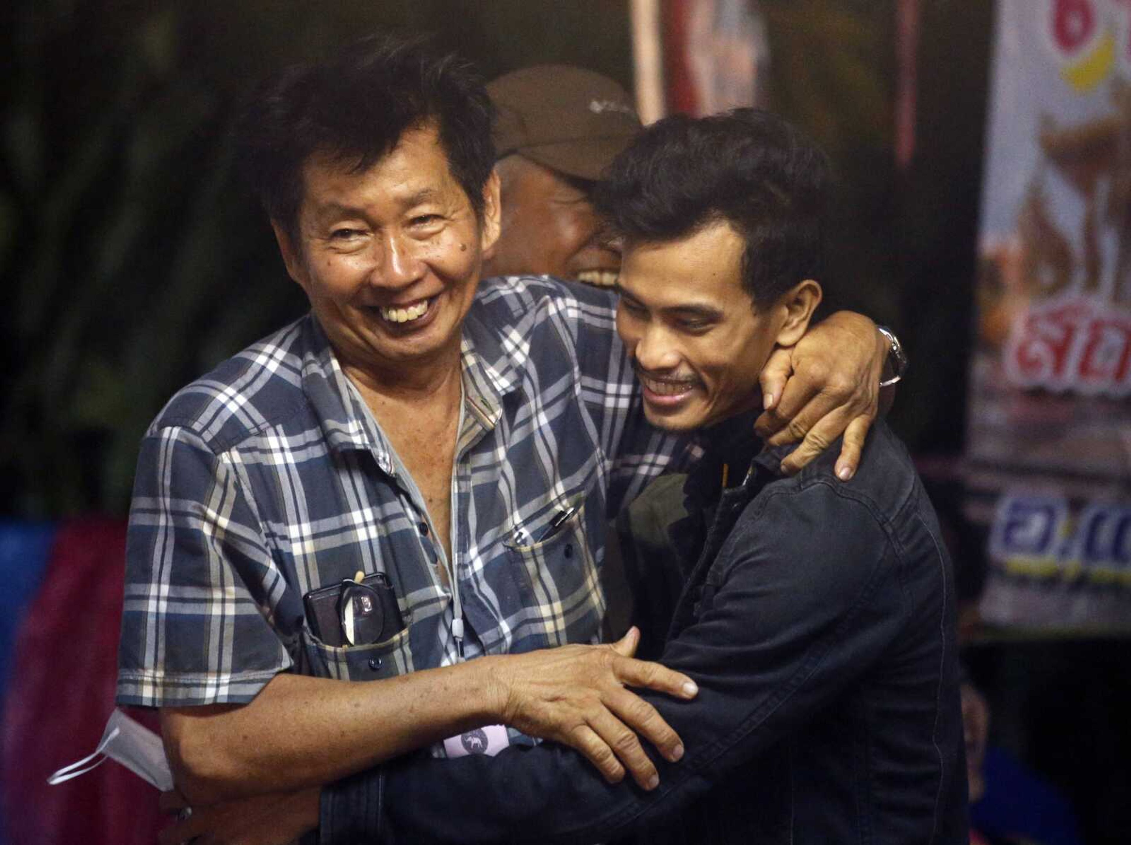 Family members smile after hearing the news Monday the missing 12 boys and their soccer coach had been found in Mae Sai, Chiang Rai province, in northern Thailand.