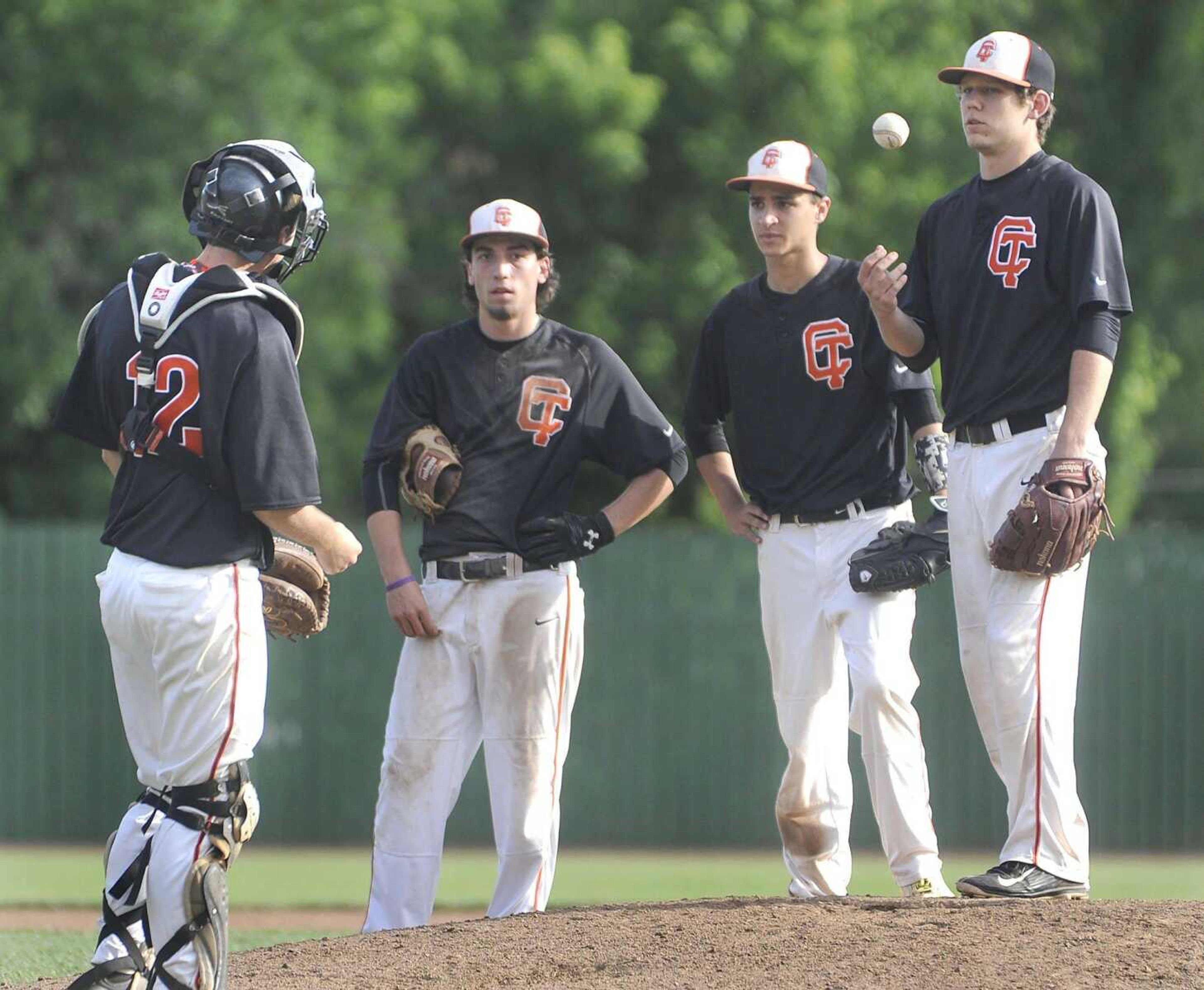 Central catcher John Young meets at the mound with third baseman Jacquen Cummins, shortstop Ryan Tegel and pitcher Josh Morse during the ninth inning against Poplar Bluff in a Class 5 District 1 semifinal Tuesday, May 19, 2015 in Farmington, Missouri. (Fred Lynch)