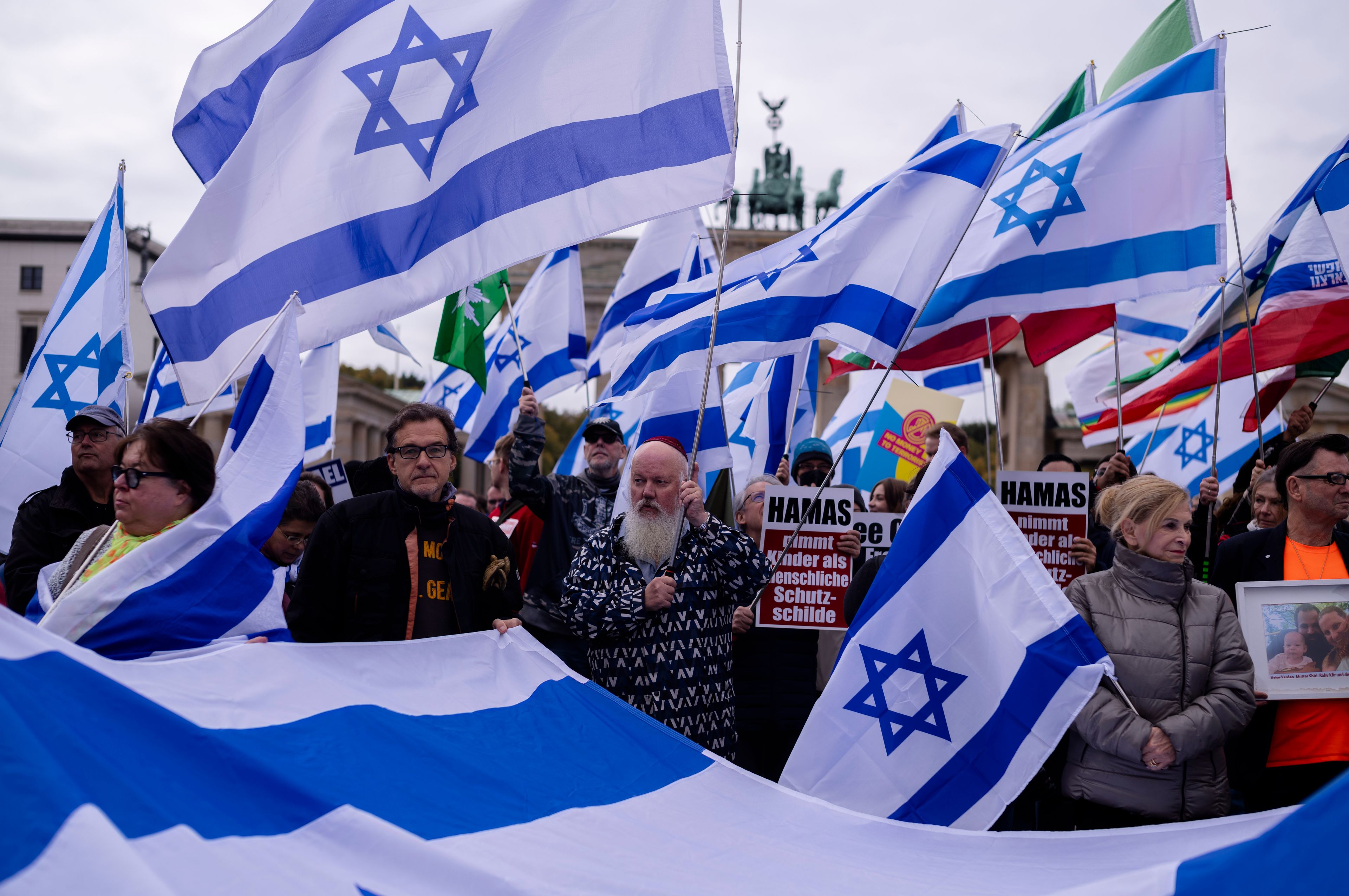 People attend a demonstration in support of Israel to mark the first anniversary of the Hamas attack on Israel, at the Brandenburg Gate in Berlin, Germany, Sunday, Oct. 6, 2024. (AP Photo/Markus Schreiber)