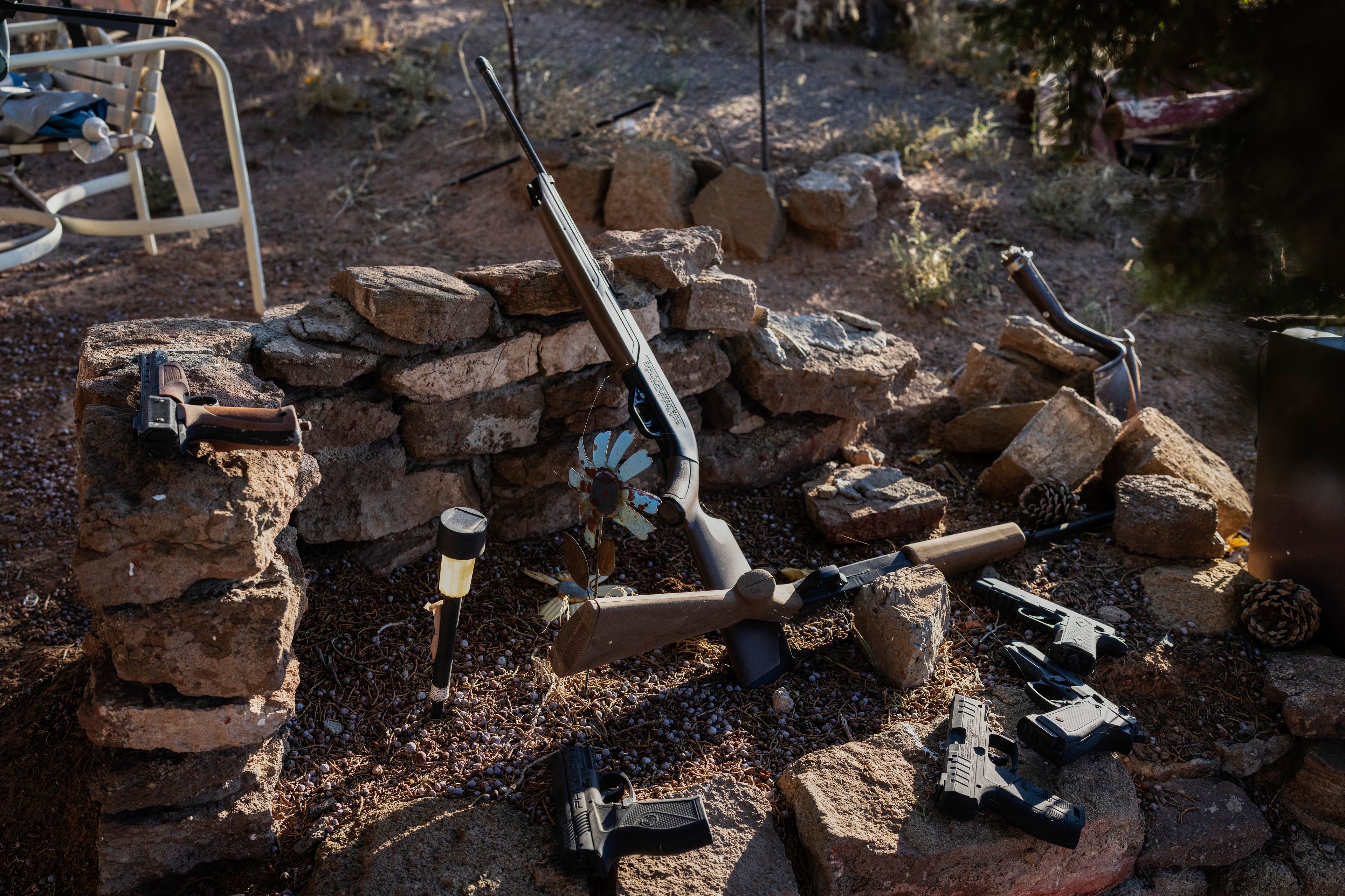 Guns are displayed in Felix Ashley's yard, on the Navajo Nation in Dilkon, Ariz., Saturday, Oct. 12, 2024. (AP Photo/Rodrigo Abd)