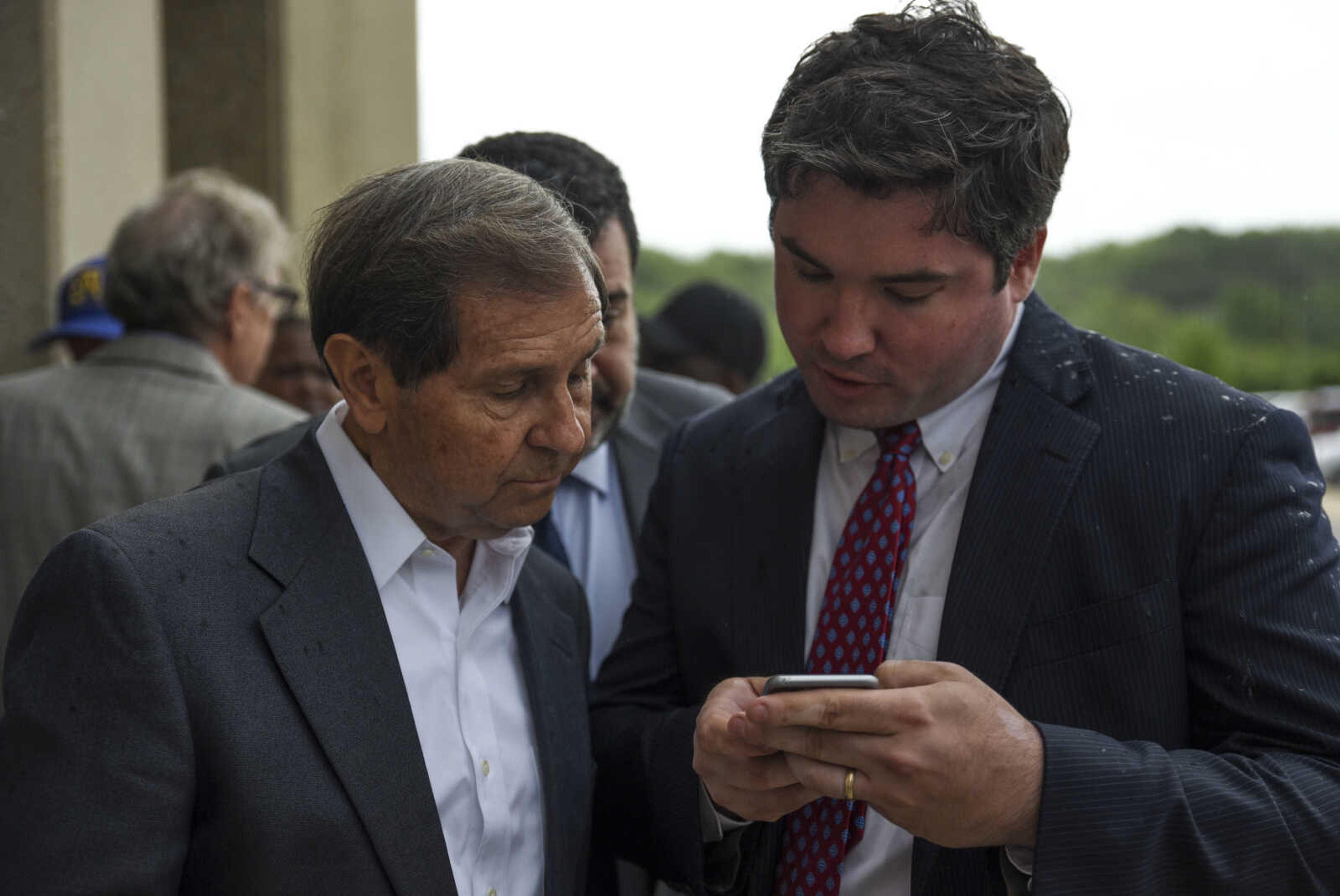 Attorneys Charlie Weiss, left, and Jonathan Potts read the attorney general's statement about David Robinson's innocence and release Monday, May 14, 2018 in Jefferson City.