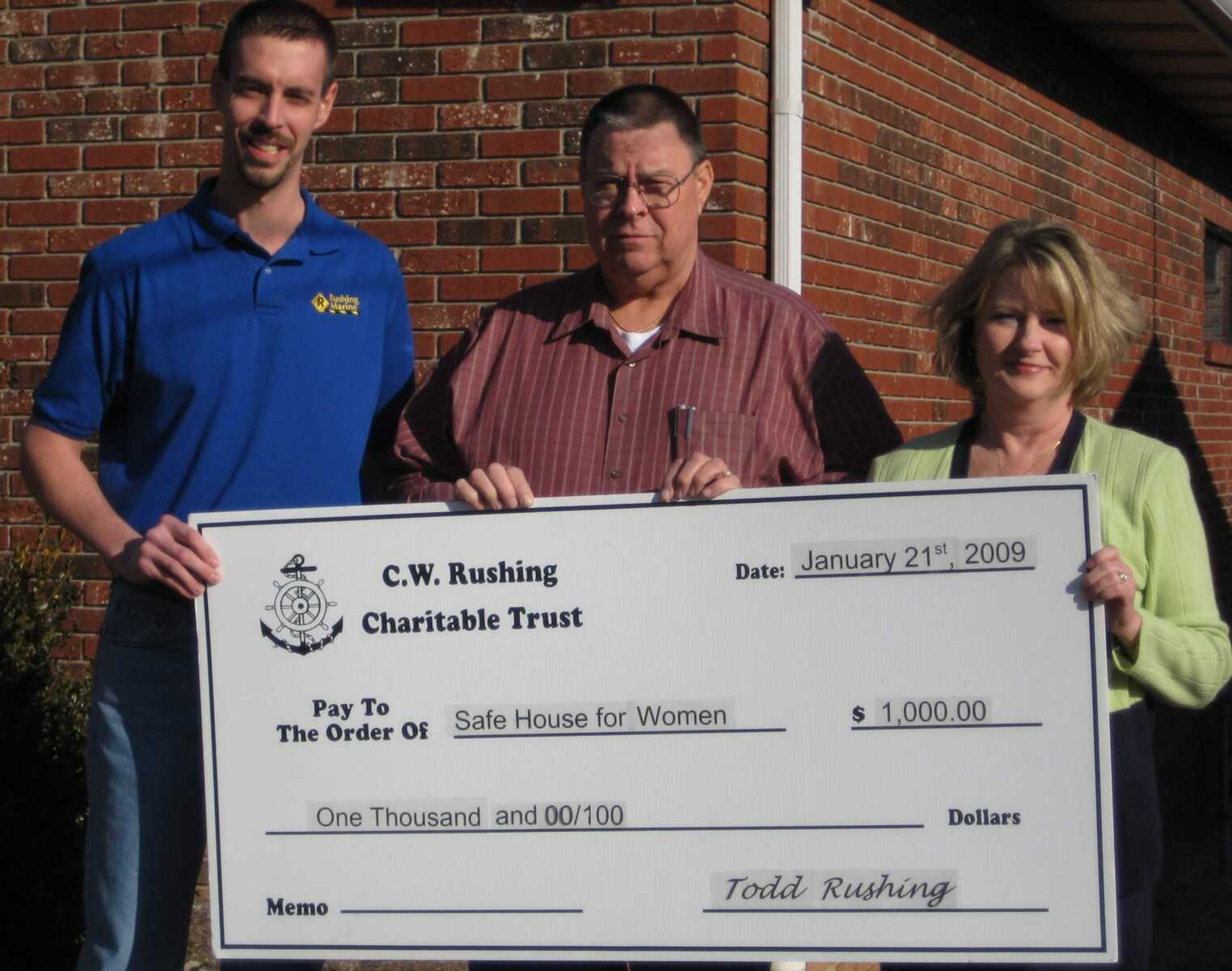 Pictured from left to right are:<br>Todd Rushing (representing the C.W. Rushing Charitable Trust)<br>Mike Rushing (representing the C.W. Rushing Charitable Trust)<br>Lisa Quick (representing the Safe House for Women)