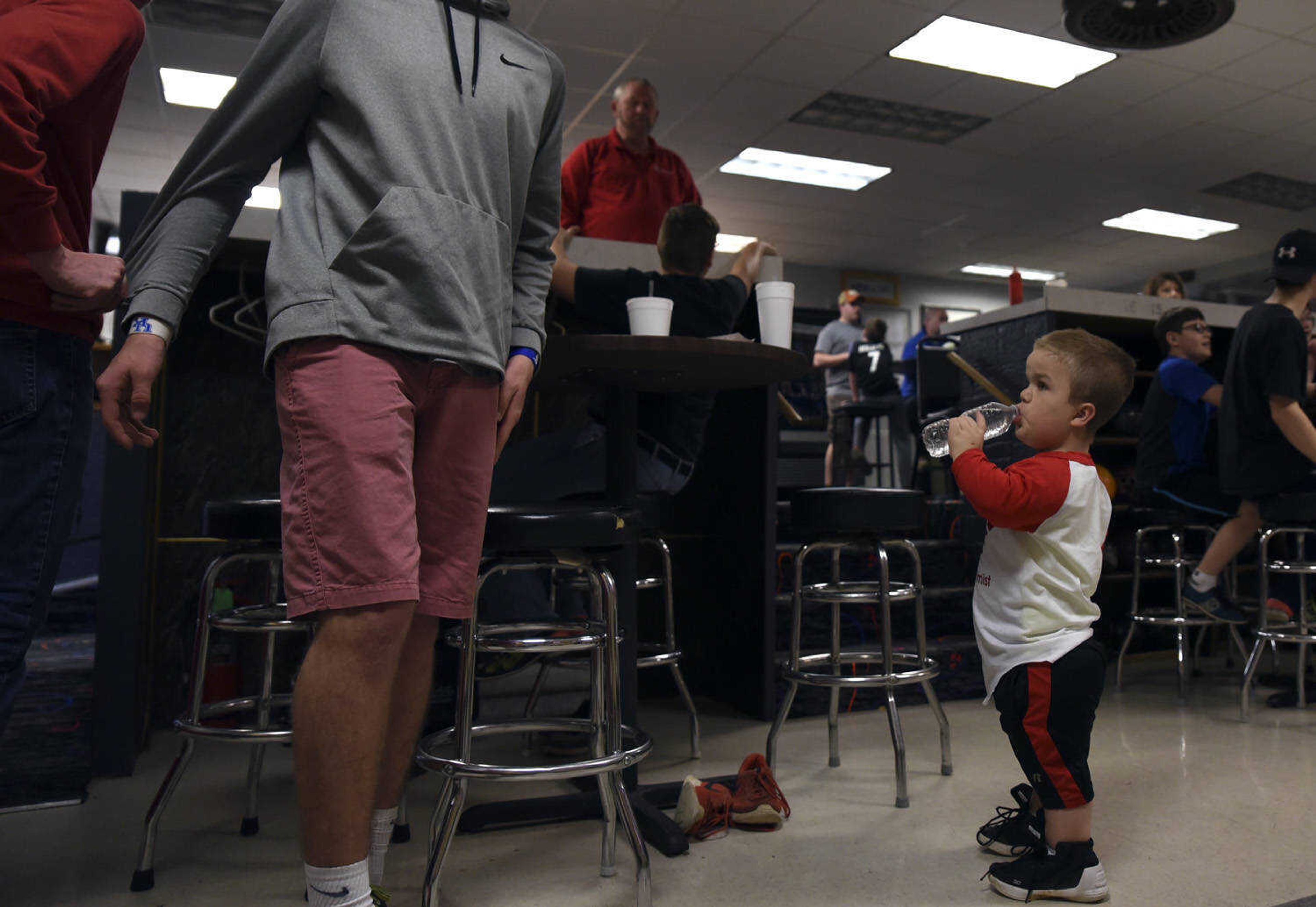 Izaac Pursley takes a drink from a bottled water while in between bowling games March 19, 2018, in Jackson.