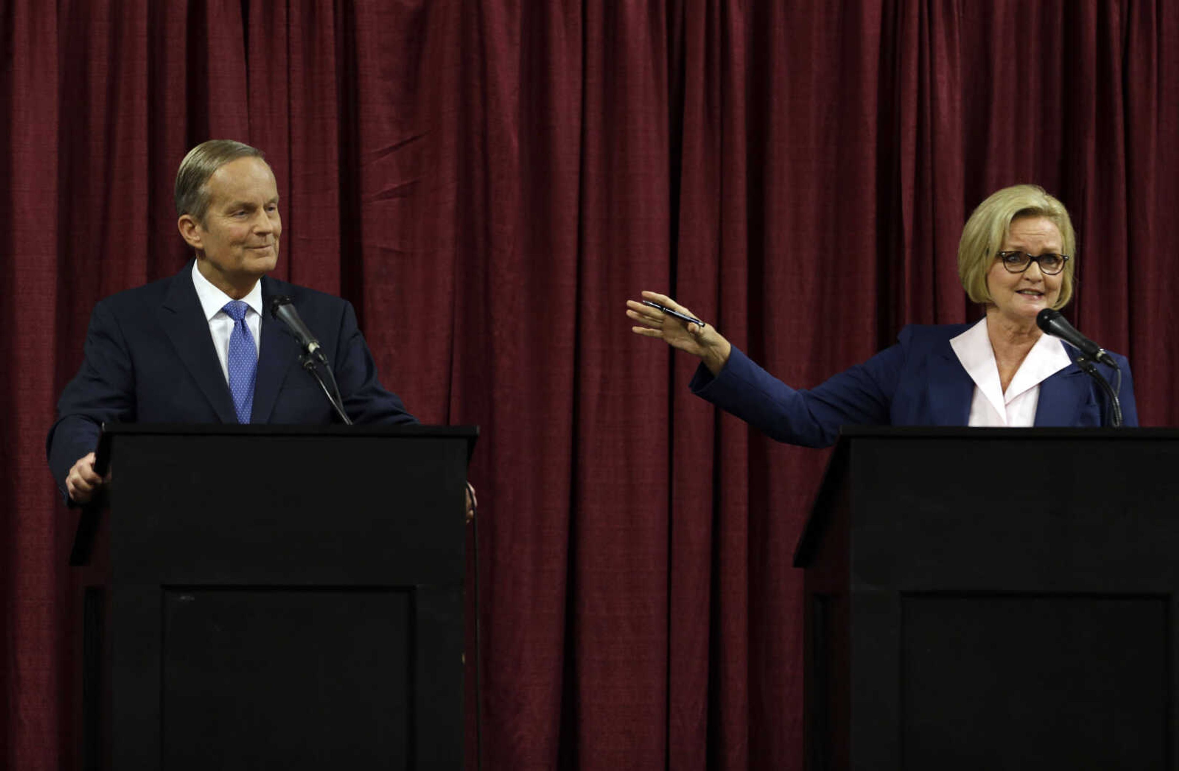 Democratic Sen. Claire McCaskill, right, speaks as she looks toward Republican challenger Rep. Todd Akin during the first debate in the Missouri Senate race Friday, Sept. 21, 2012, in Columbia, Mo. (AP Photo/Jeff Roberson)