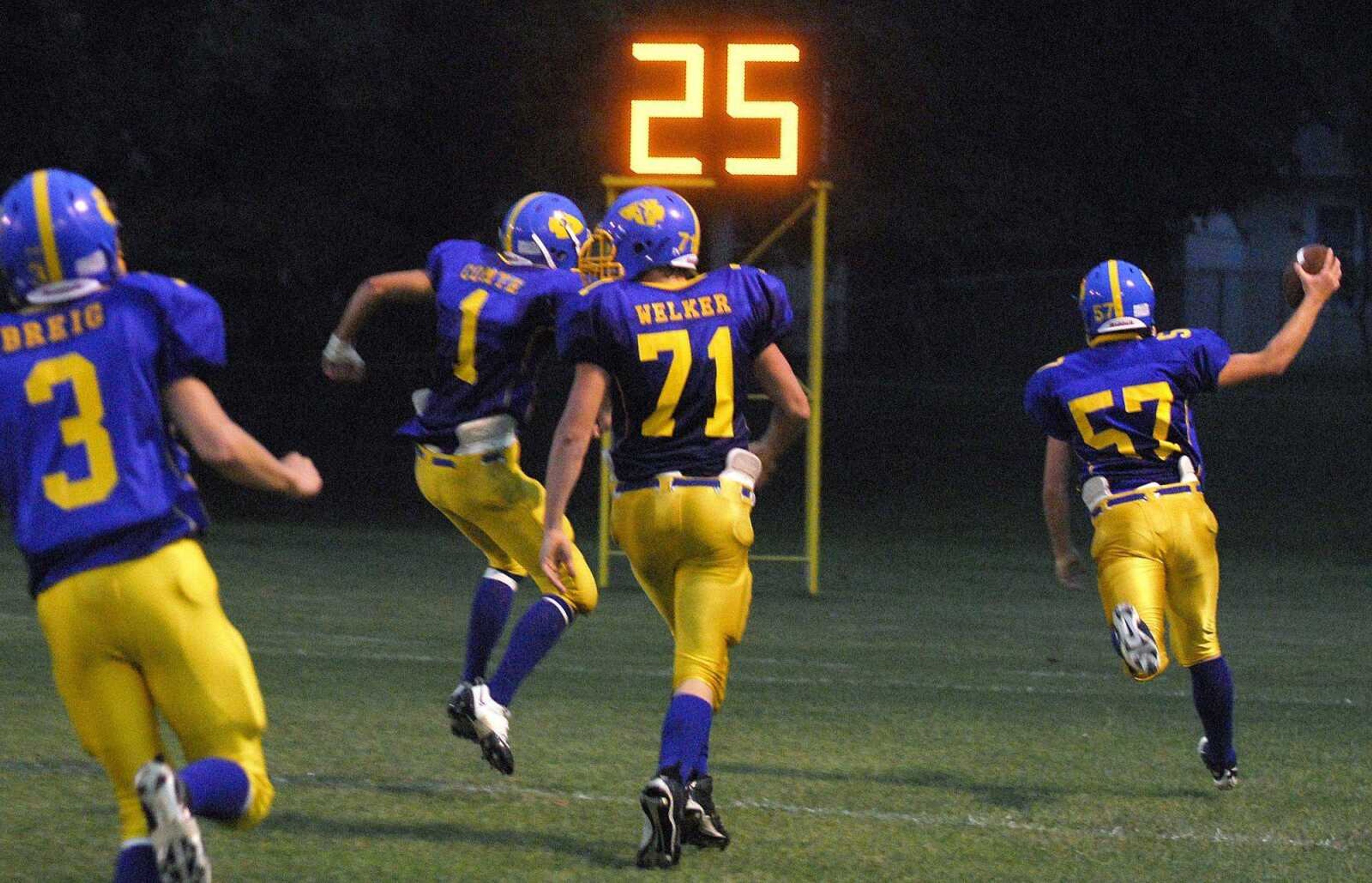 St. Vincent junior Taylor Sauer, right, returns a fumble 16 yards for a touchdown against the Missouri Military Academy during their game Friday in Perryville, Mo. (Laura Simon)