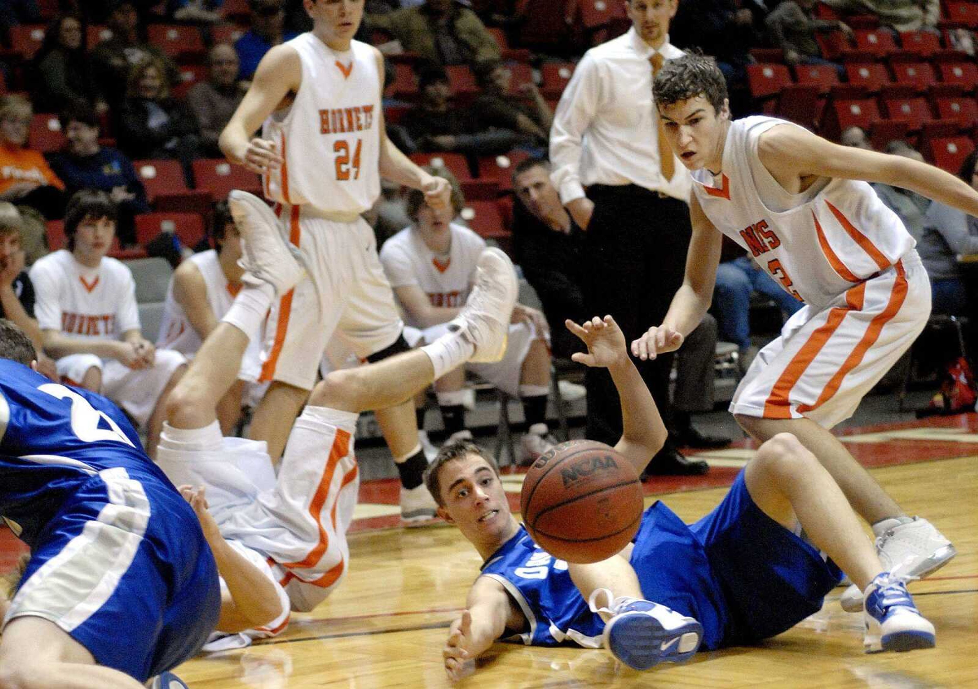 Oak Ridge's Kyle Rohde, bottom, and Advance's Hunter Wilson scurry for a loose ball during their game Monday at the Southeast Missourian Christmas tournament. (Laura Simon)