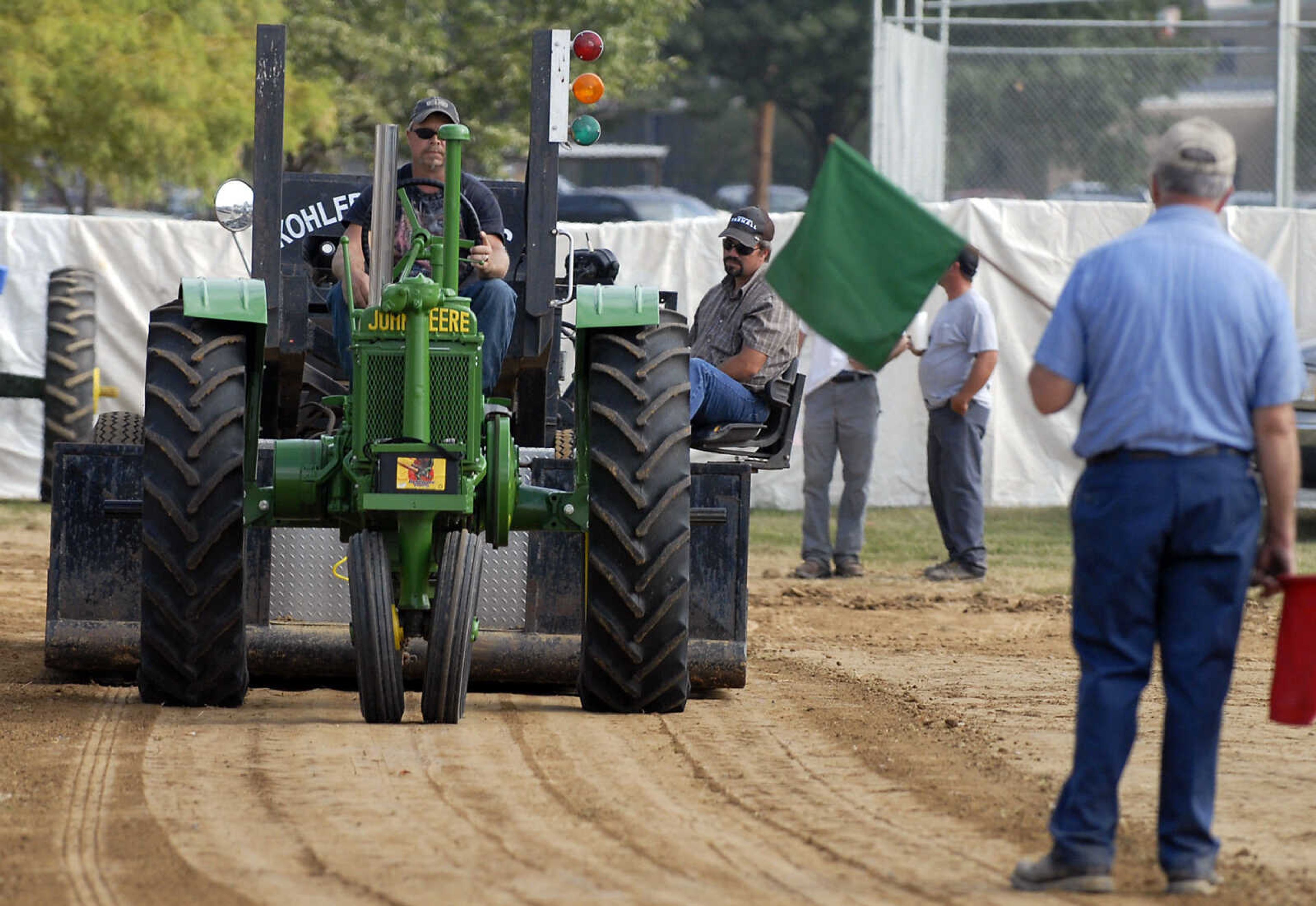 KRISTIN EBERTS ~ keberts@semissourian.com

Quentin Overbeck drives his 1937 John Deere model B tractor during the antique tractor pull put on by the Egypt Mills Antique Tractor Club at the SEMO District Fair on Saturday, Sept. 10, 2011.