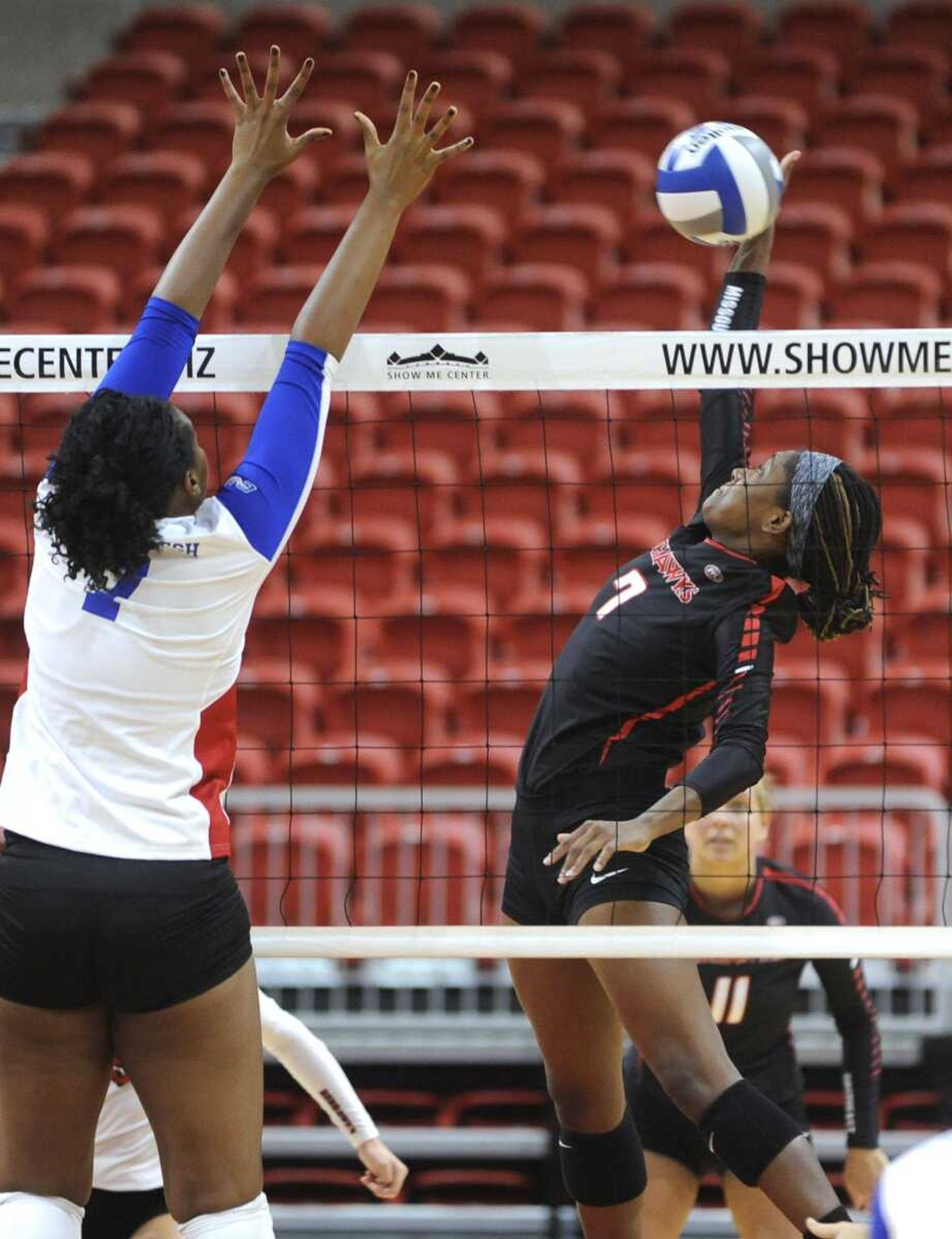 Southeast Missouri State middle blocker Alyssa McElderry hits the ball against Louisiana Tech's Alexa Lister during the first set Saturday, Aug. 27, 2016 at the Show Me Center.