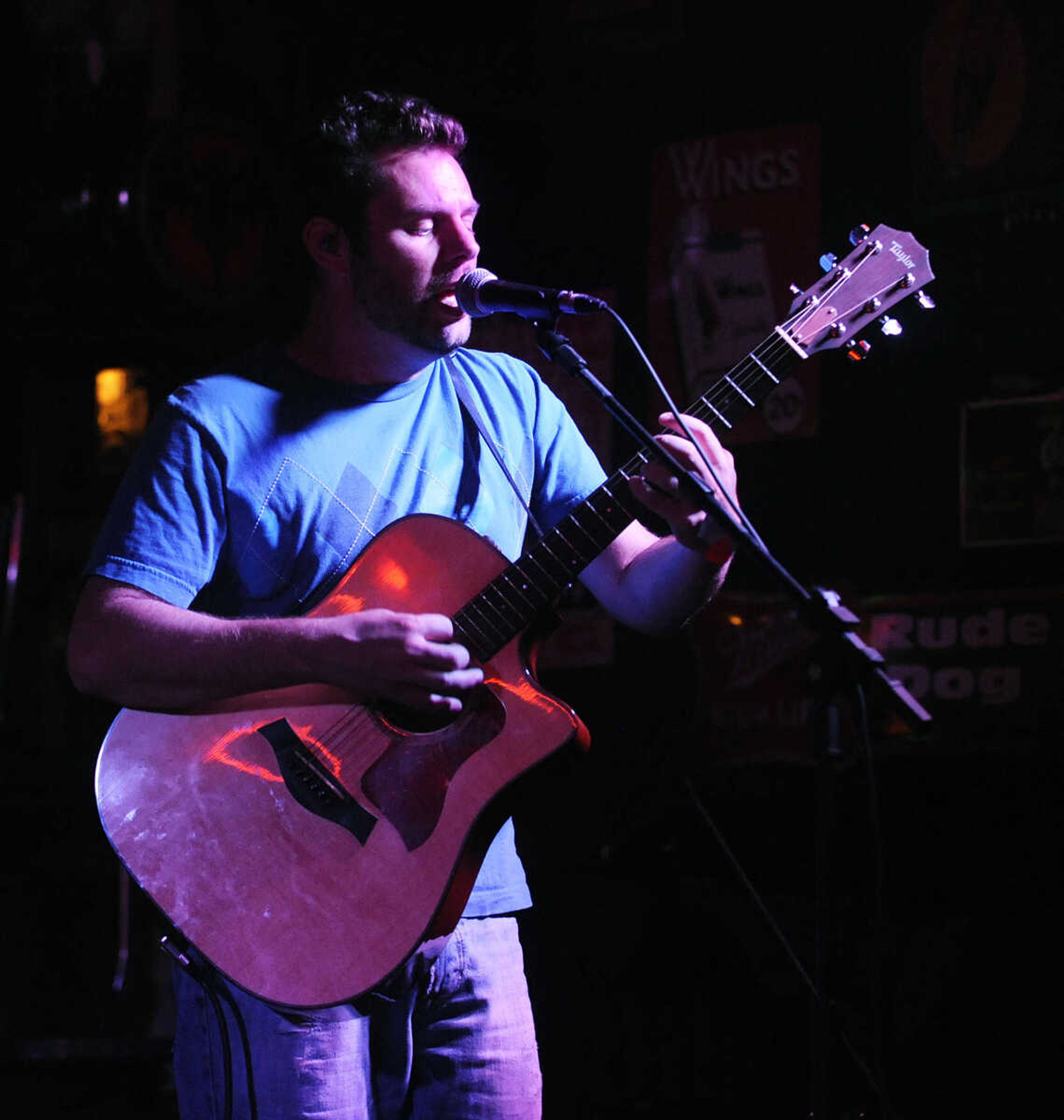 Mike Renick sings during a performance by the Mike Renick Band at the Rude Dog Pub, 123 Main Street, Friday, June 22.