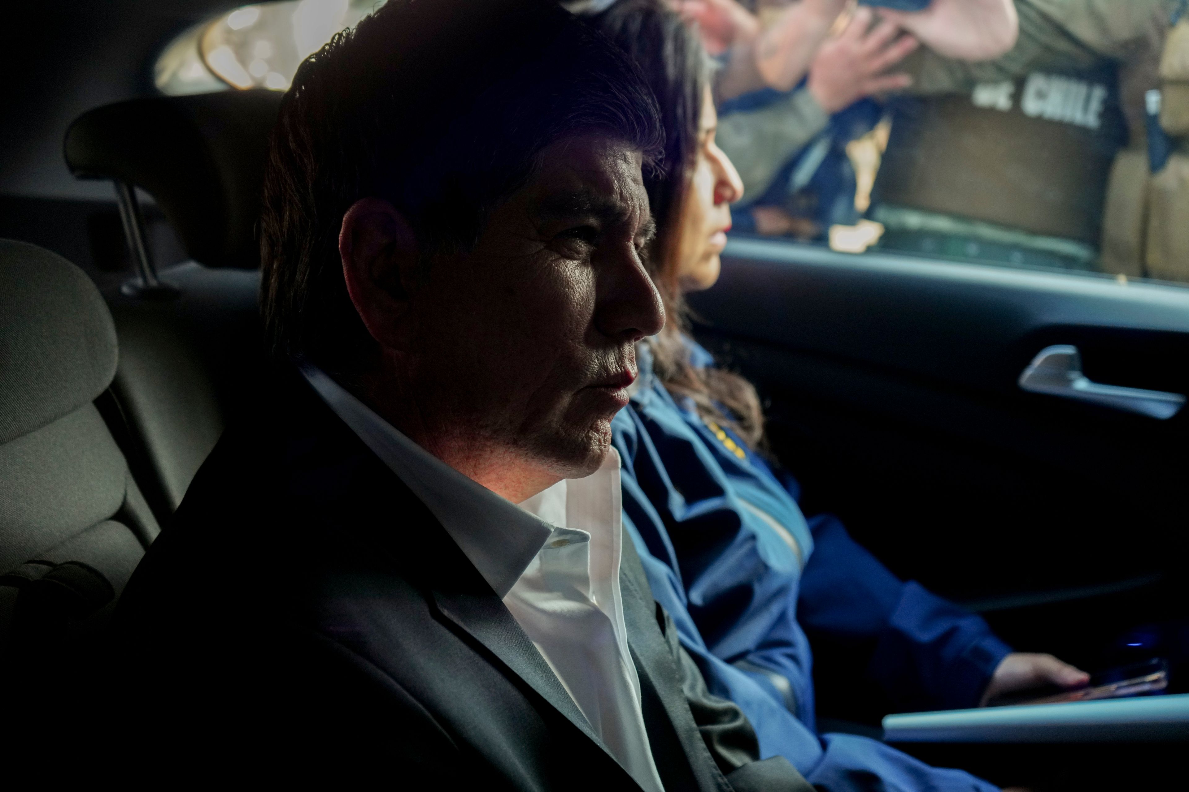 Former Deputy Interior Minister Manuel Monsalve is transported by investigative police agents to court for his preliminary hearing one day after he was arrested on suspicion of rape that led to his resignation, in Santiago, Chile, Nov. 15, 2024. (AP Photo/Esteban Felix)