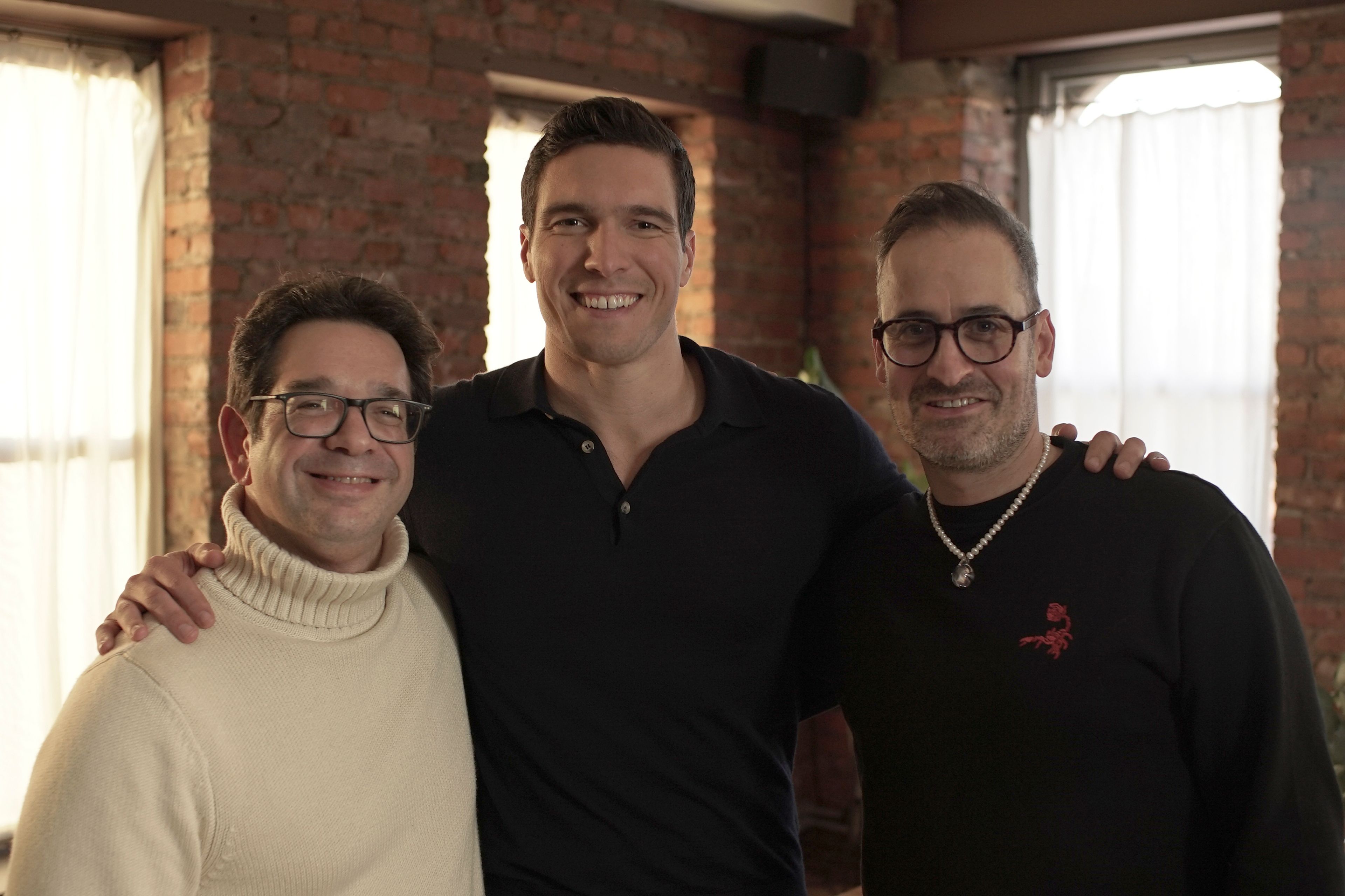 This image released by Warner Bros. Pictures shows director Peter Ettedgui, left, Will Reeve, center, and director Ian Bonhote, during the filming of the documentary "Super/Man: The Christopher Reeve Story." (Warner Bros. Pictures via AP)