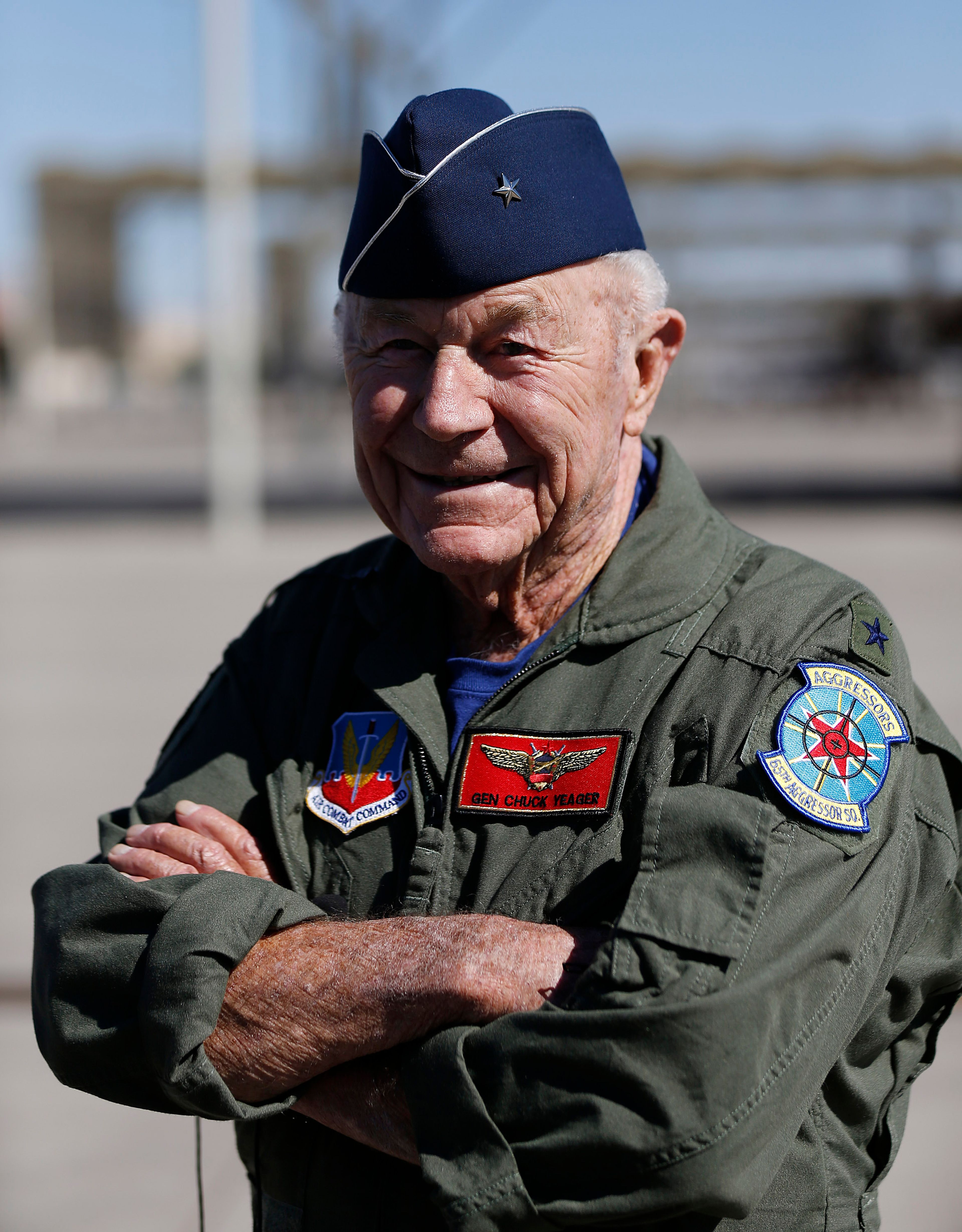 Retired Air Force Brig. Gen. Charles Yeager talks to members of the media following a re-enactment flight commemorating his breaking of the sound barrier 65 years ago on Sunday, Oct. 14, 2012, at Nellis Air Force Base, Nev. 