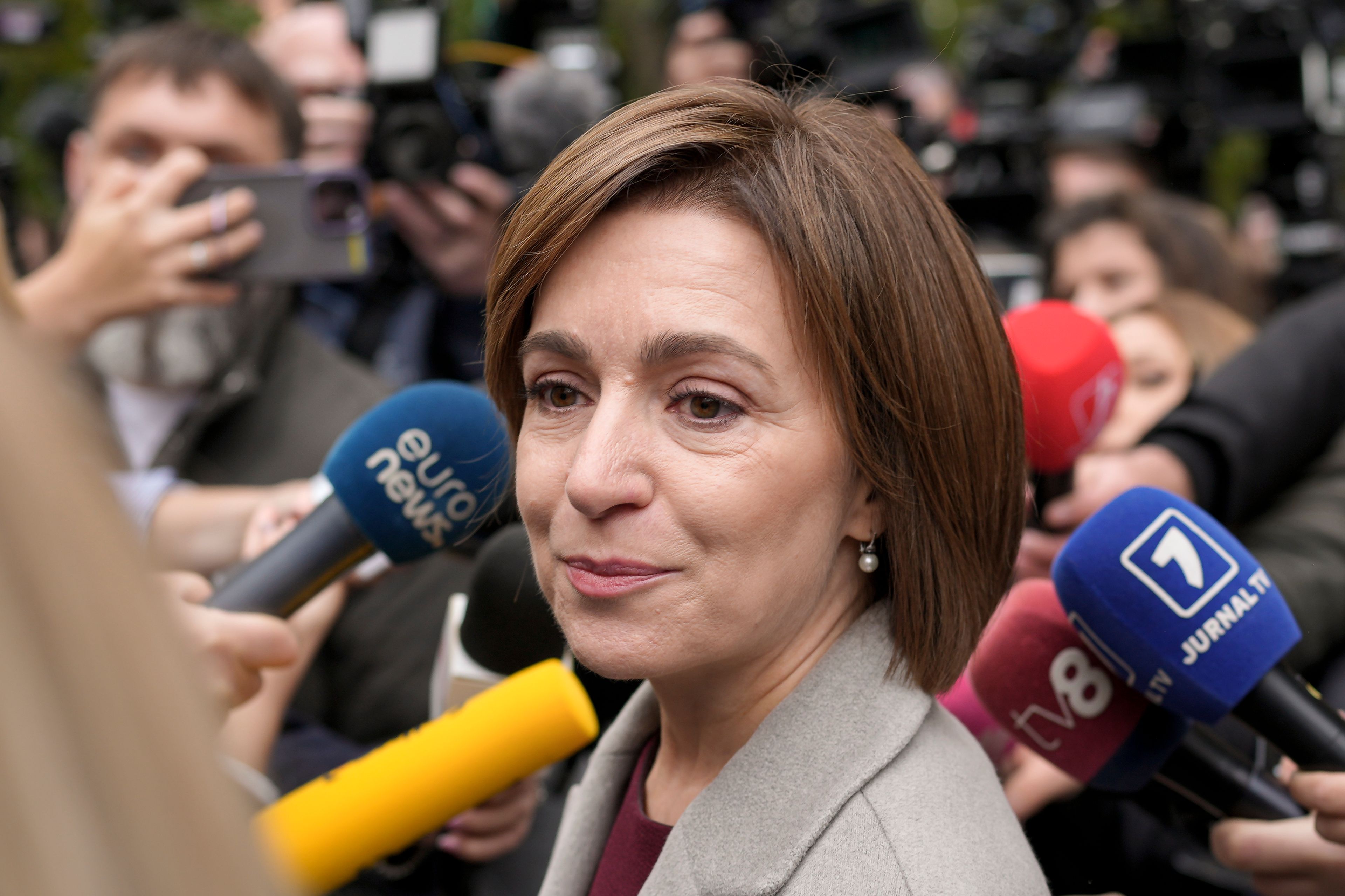 Moldova's President Maia Sandu speaks to the media after casting her vote in Chisinau, Moldova, Sunday, Oct. 20, 2024, during a presidential election and a referendum on whether to enshrine in the Constitution the country's path to European Union membership. (AP Photo/Vadim Ghirda)