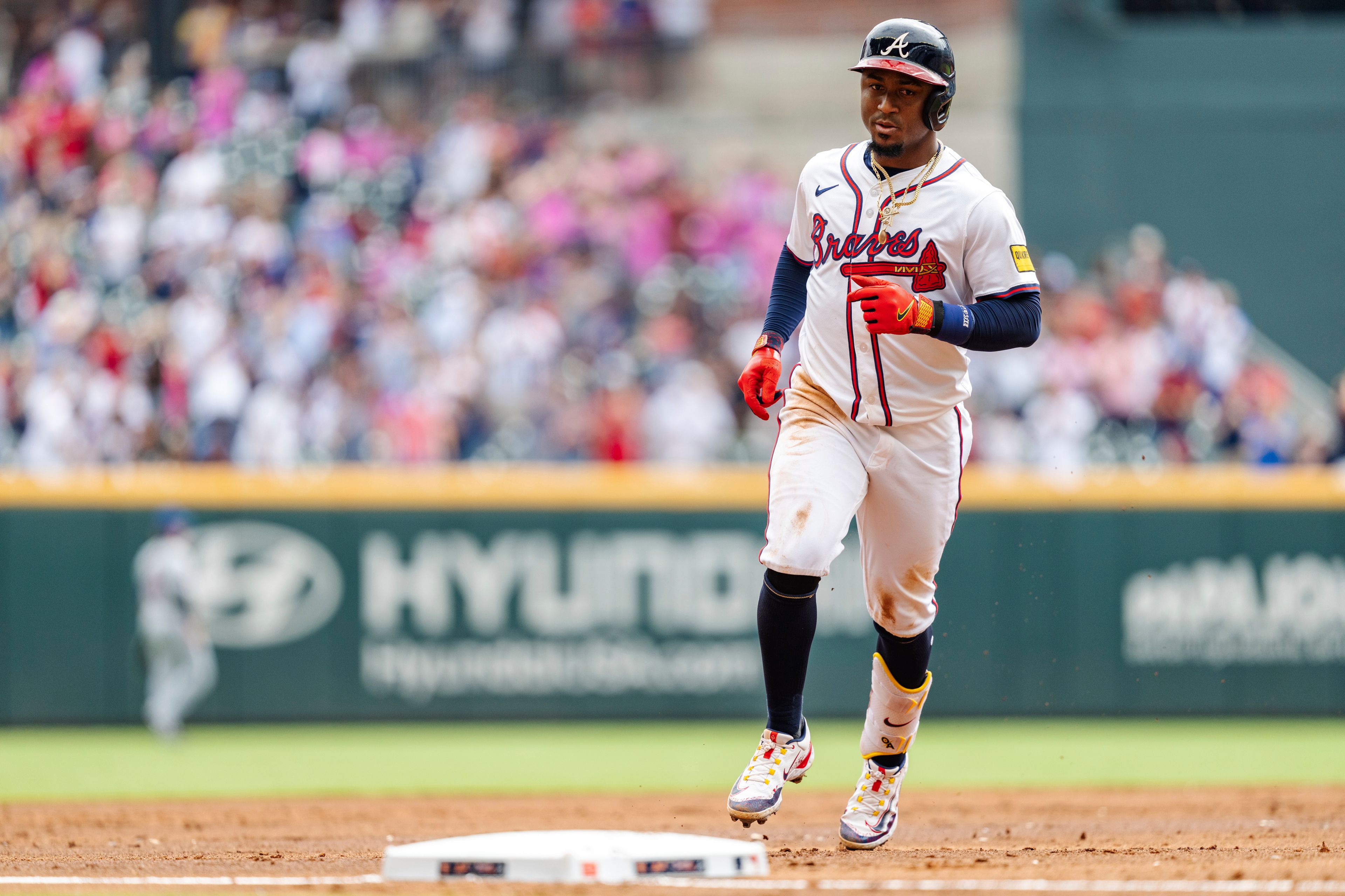 Atlanta Braves' Ozzie Albies prepares to tag third base after hitting a two-run home run in the third inning of a baseball game against the New York Mets, Monday, Sept. 30, 2024, in Atlanta. (AP Photo/Jason Allen)