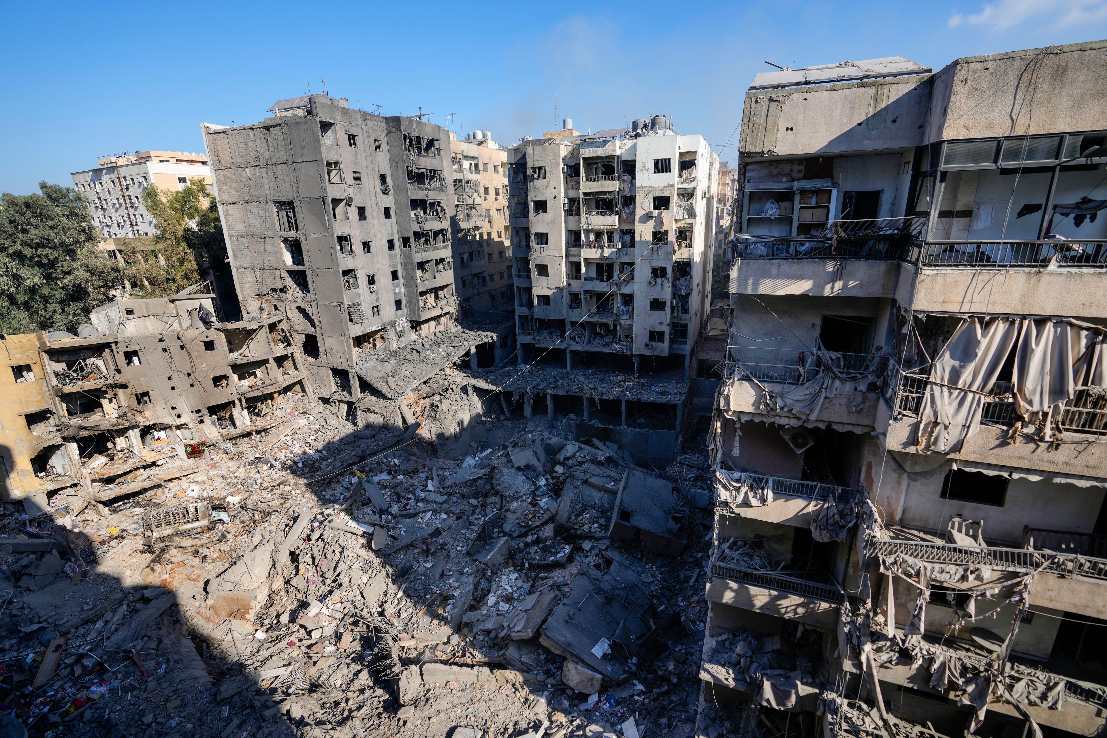 Damaged buildings at the site of the assassination of Hezbollah leader Hassan Nasrallah in Beirut's southern suburbs, Sunday, Sept. 29, 2024. (AP Photo/Hassan Ammar)