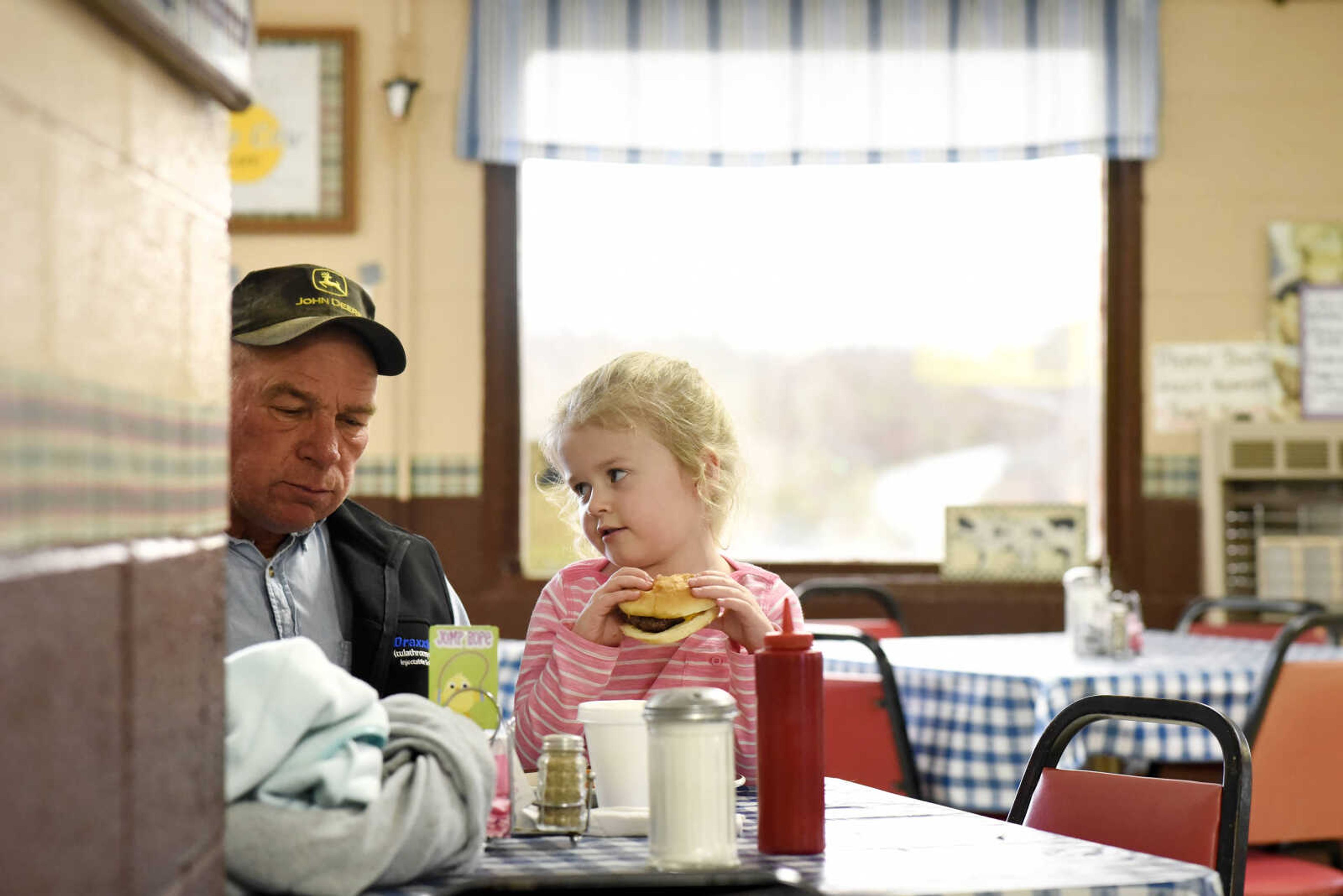 Kristen Vallett eats lunch with her grandpa, Gordon Koch, on Monday, March 27, 2017, at Bonnie's Moo Cow Cafe in Patton, Missouri.