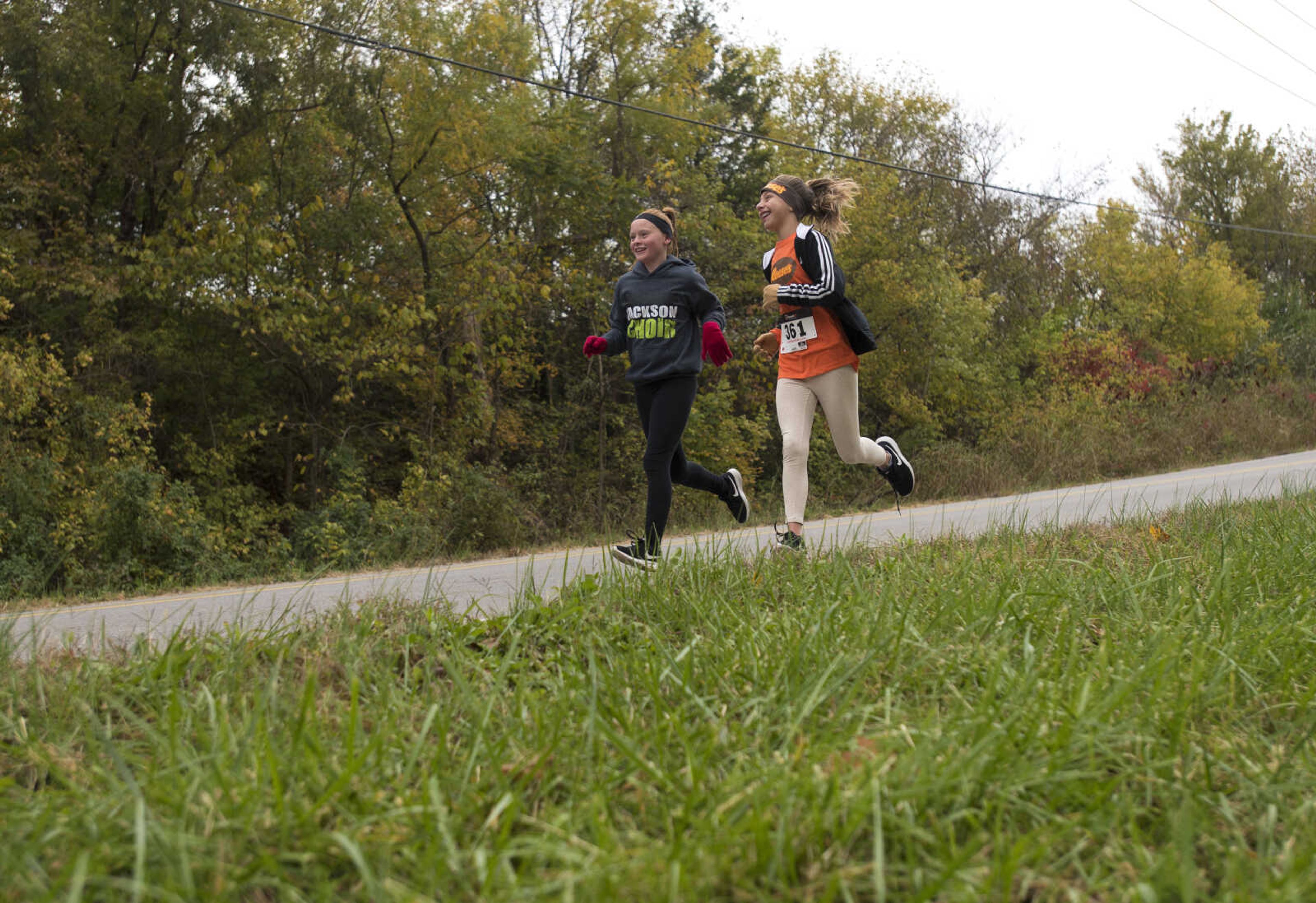 Runners race during the first Ghost and Goblin Gallop 5k race to raise money for the Crossroads Backpack Fair on Saturday, Oct. 28, 2017 in Jackson.