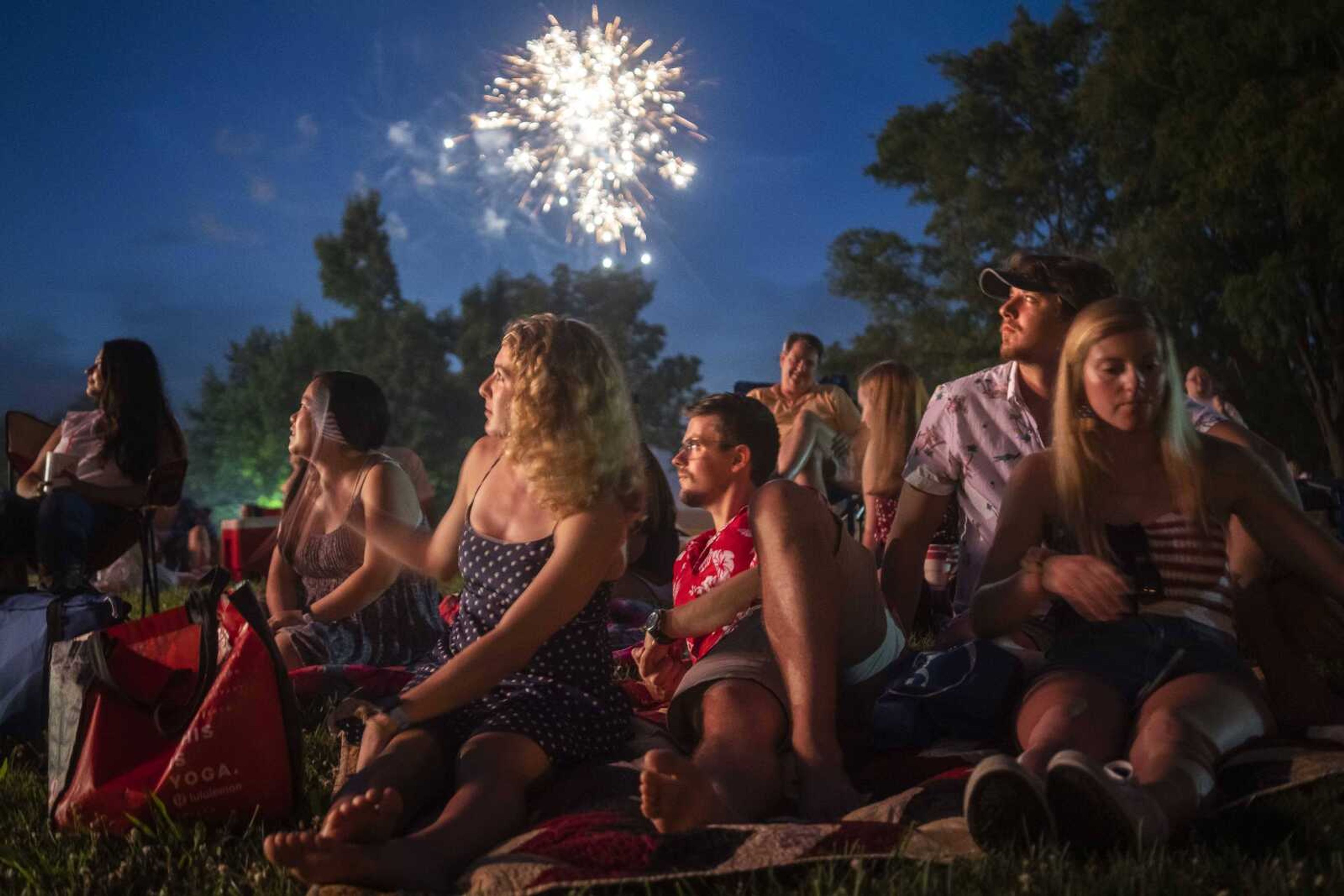 Spectators, from right, Sarah Liefer, Robbie Lindner, Danny Moeller and Molly Kuettel watch fireworks Saturday, July 4, 2020, at the Jackson Municipal Band Shell in Jackson.