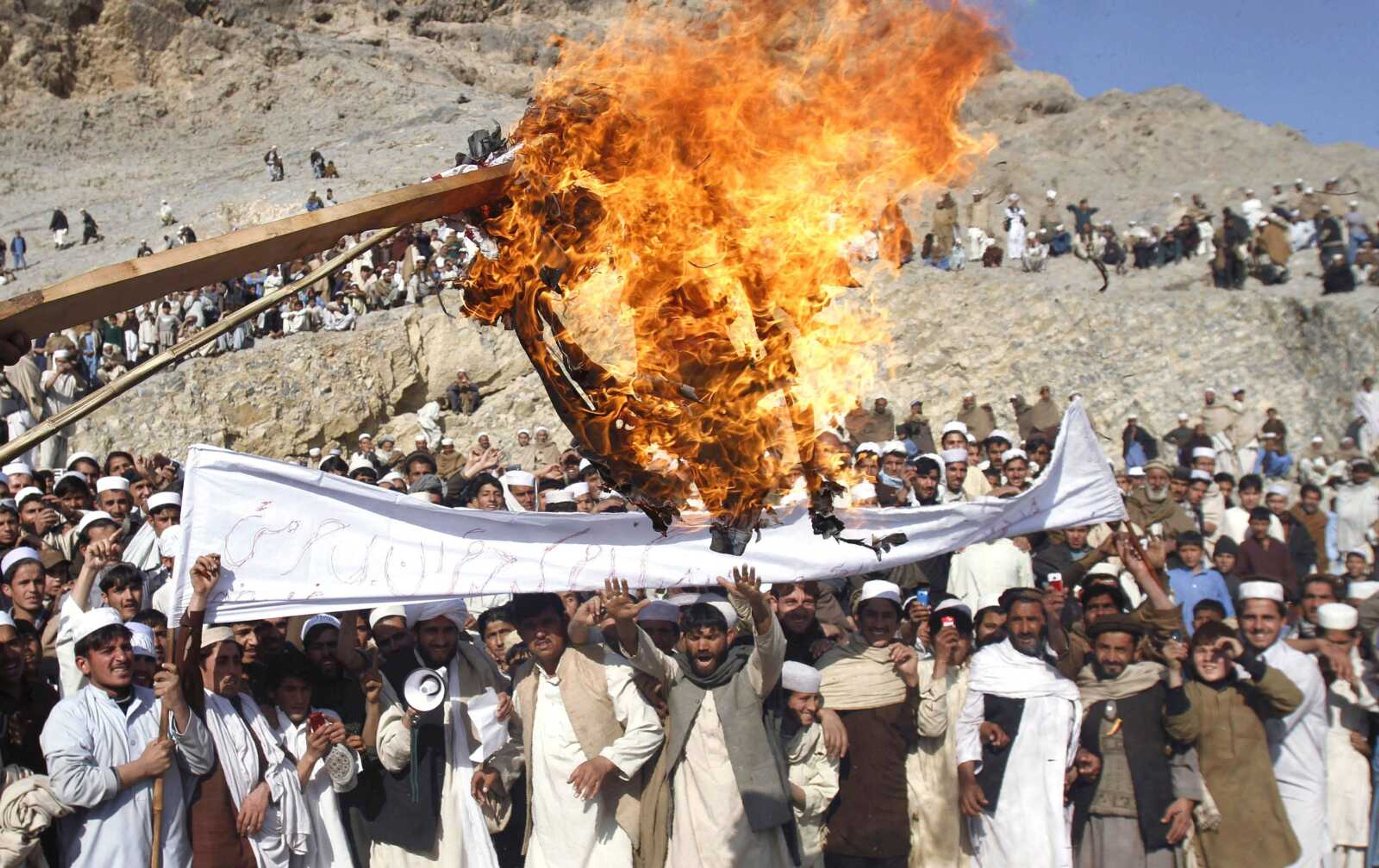 Afghans burn an effigy representing President Barack Obama during an anti-U.S. protest Feb. 24 in Ghani Khail, east of Kabul, Afghanistan, over the burning of Qurans at a U.S. military base. (Associated Press file)